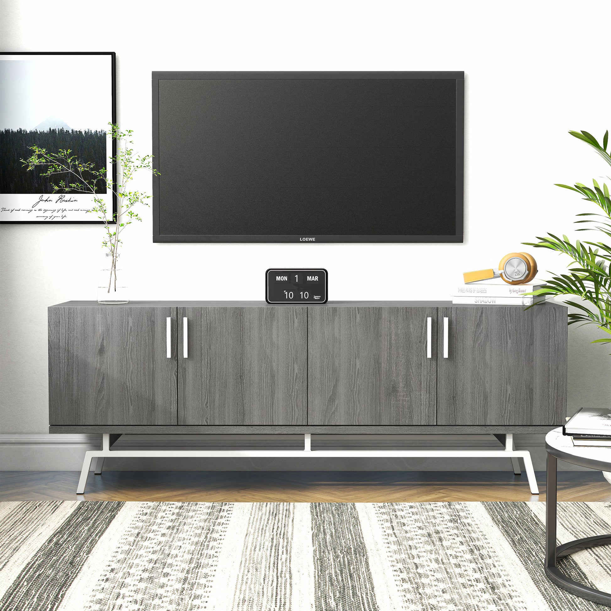 Front-facing modern distressed gray and silver four-door TV stand in a living room with accessories