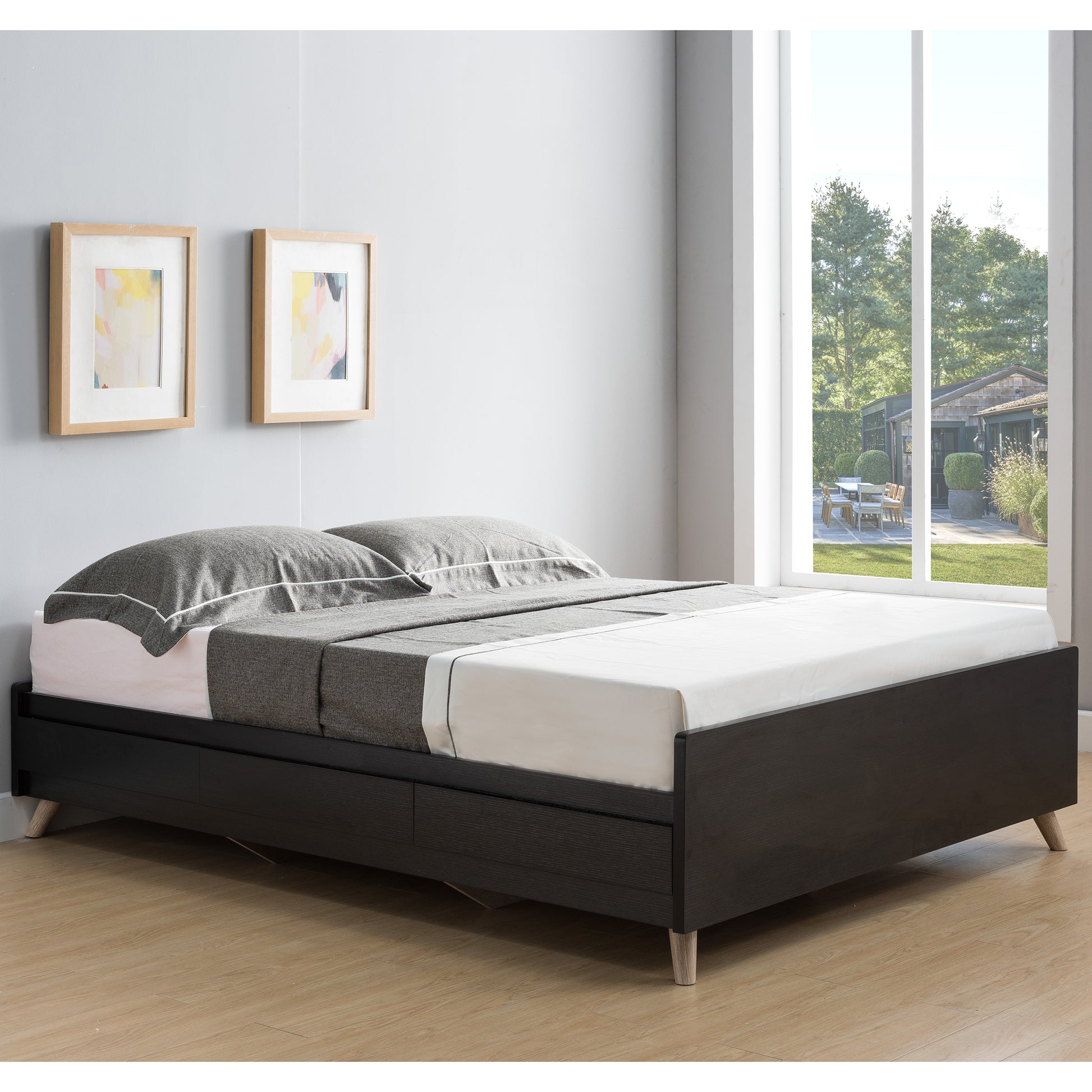Right angled contemporary cappuccino three-drawer queen platform bed in a bedroom with linens