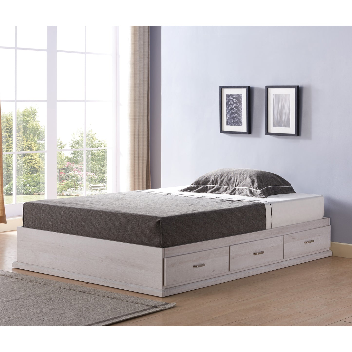 Left angled contemporary three-drawer storage bed in a bedroom with accessories