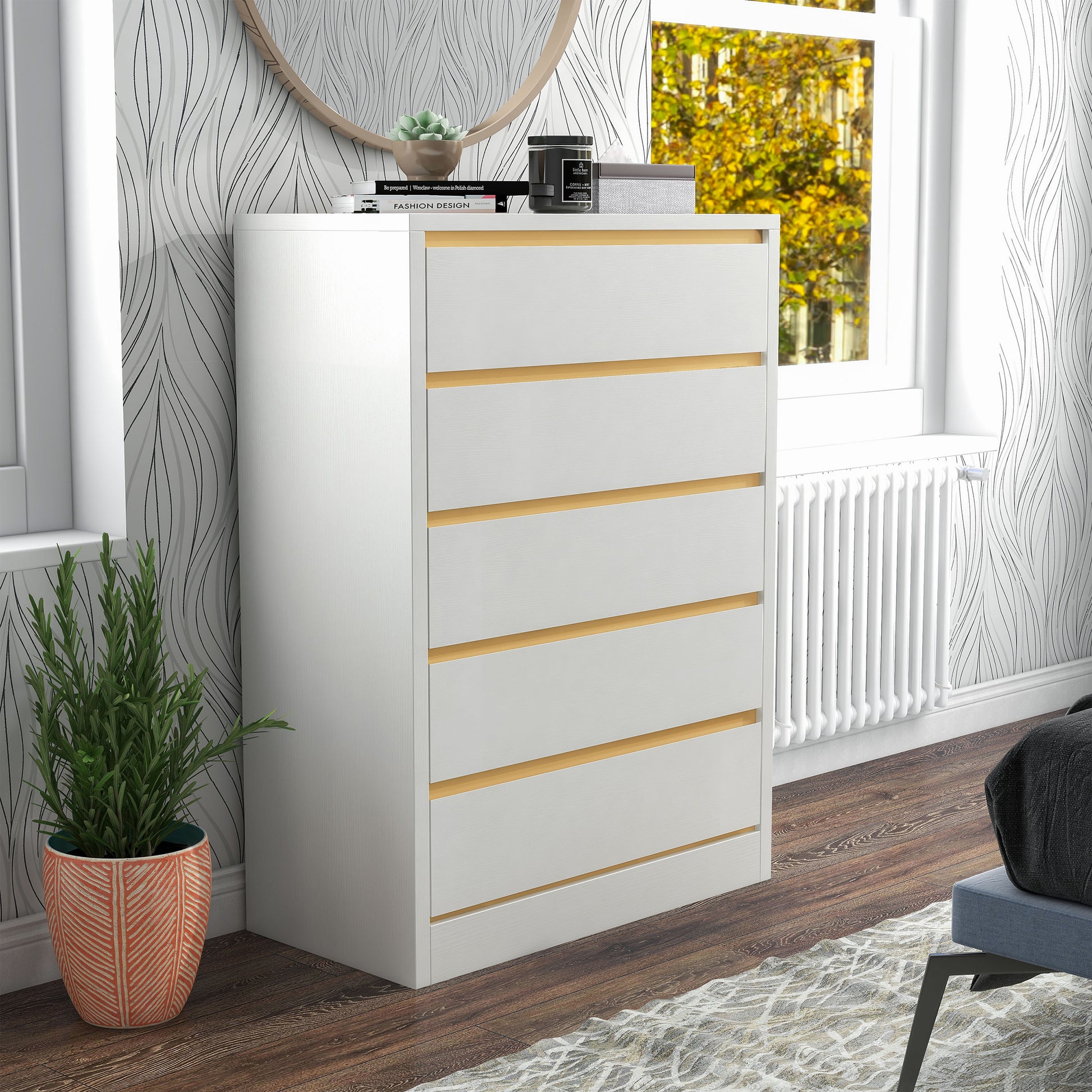 Right angled modern white and gold five-drawer tall dresser in a bedroom with accessories