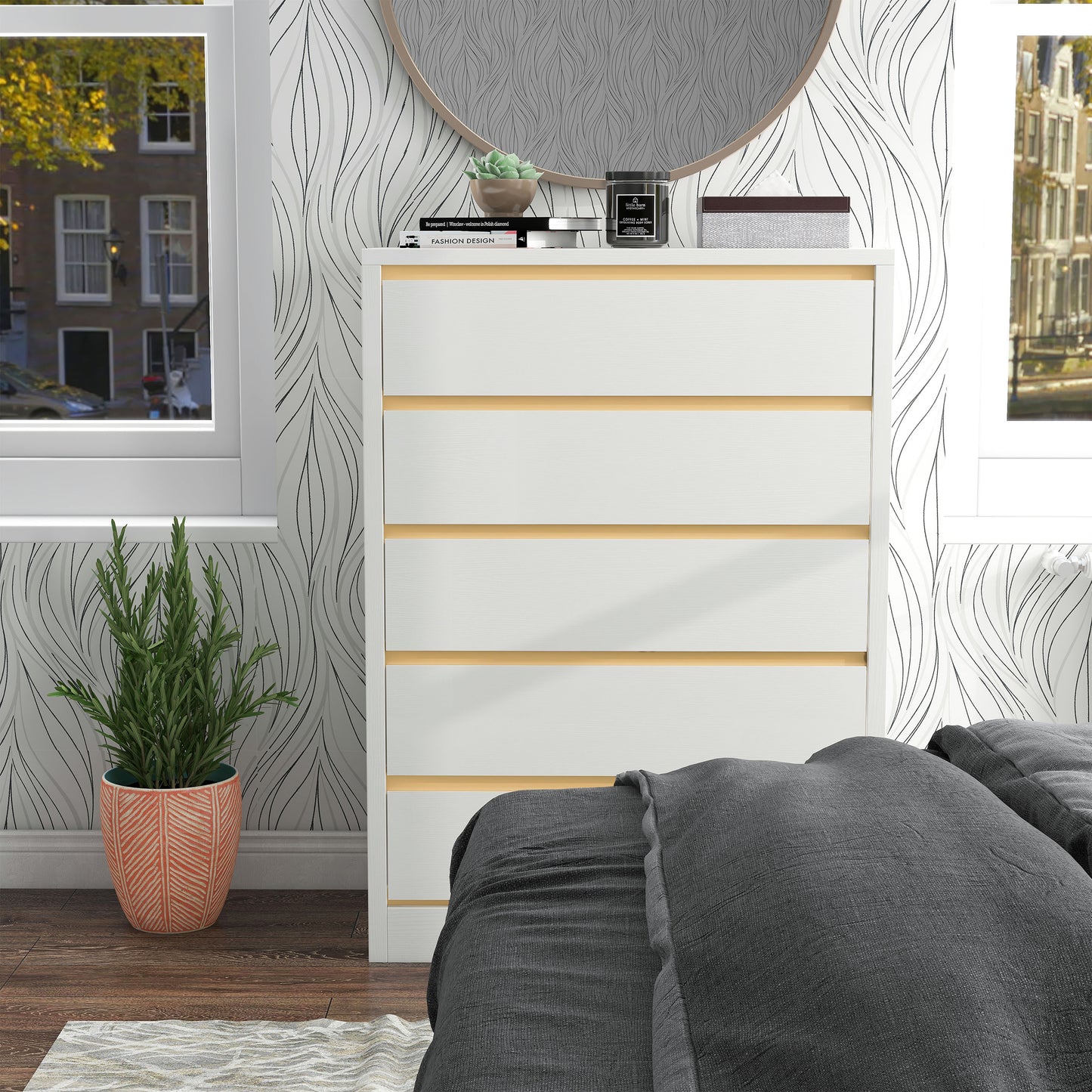 Front-facing modern white and gold five-drawer tall dresser in a bedroom with accessories