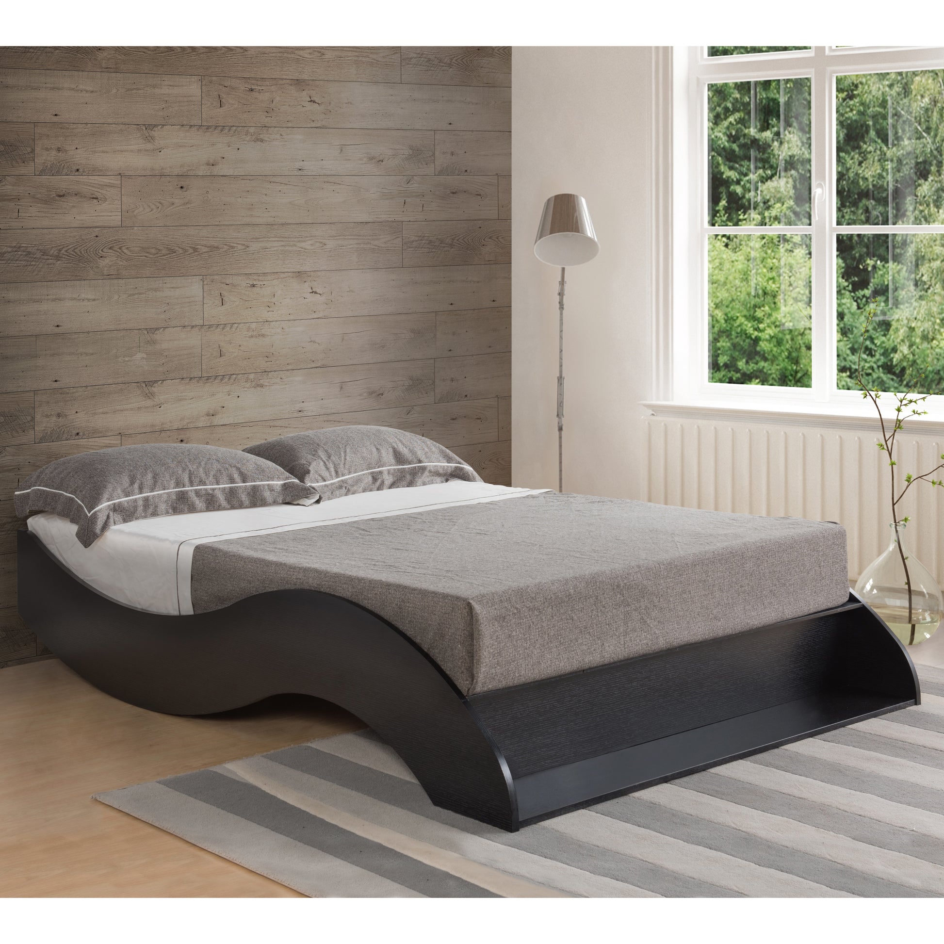 Right angled contemporary cappuccino curvy platform storage bed (with a bookcase headboard not shown) in a bedroom with accessories