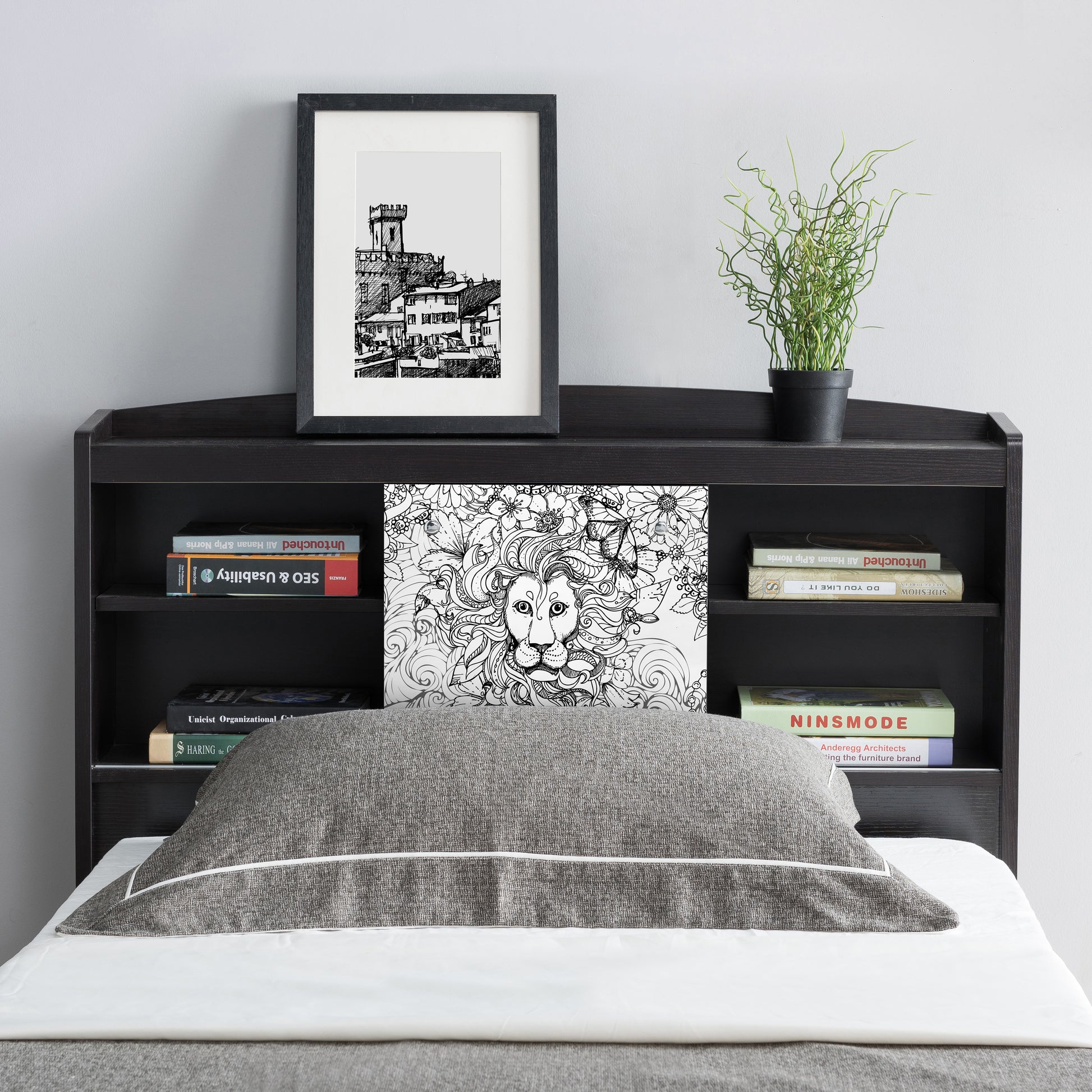 Front-facing headboard detail of a contemporary cappuccino platform storage bed with a bookcase headboard in a bedroom with accessories