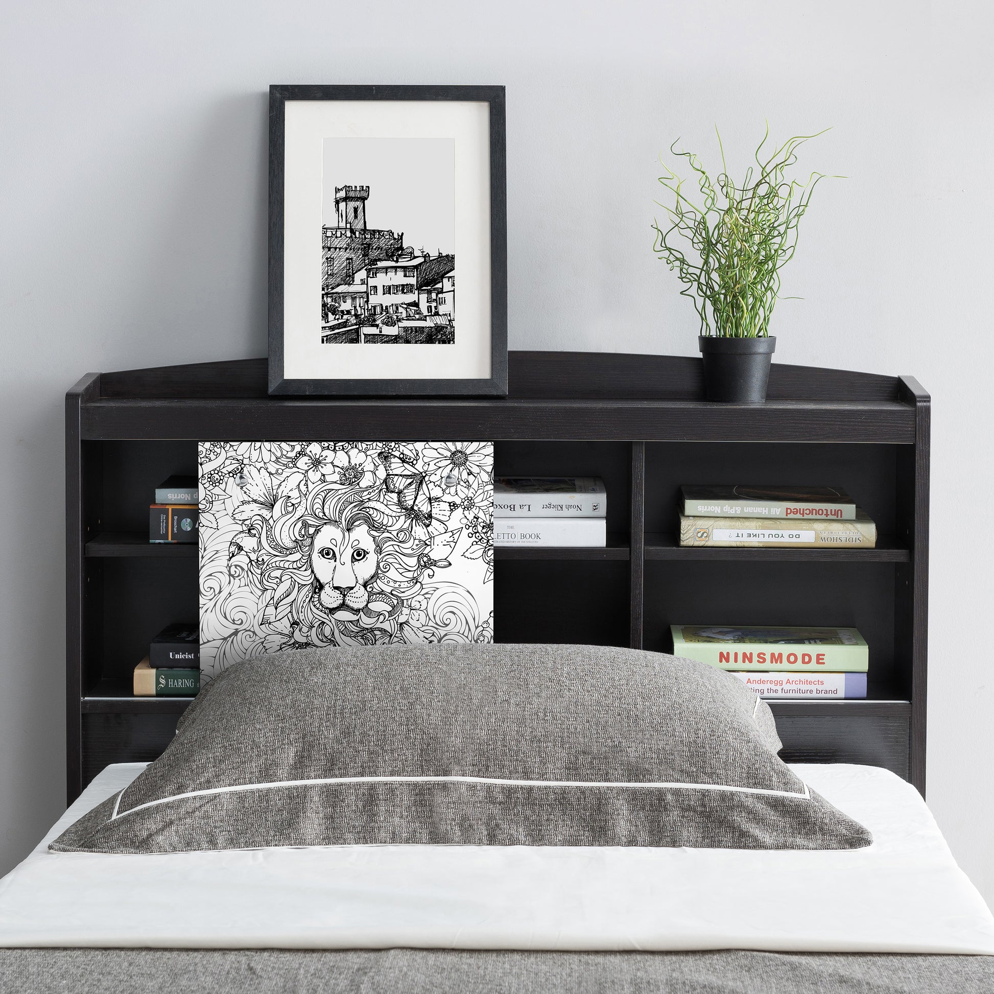 Front-facing contemporary cappuccino six-shelf bookcase headboard with sliding center panel to one side in a bedroom with accessories