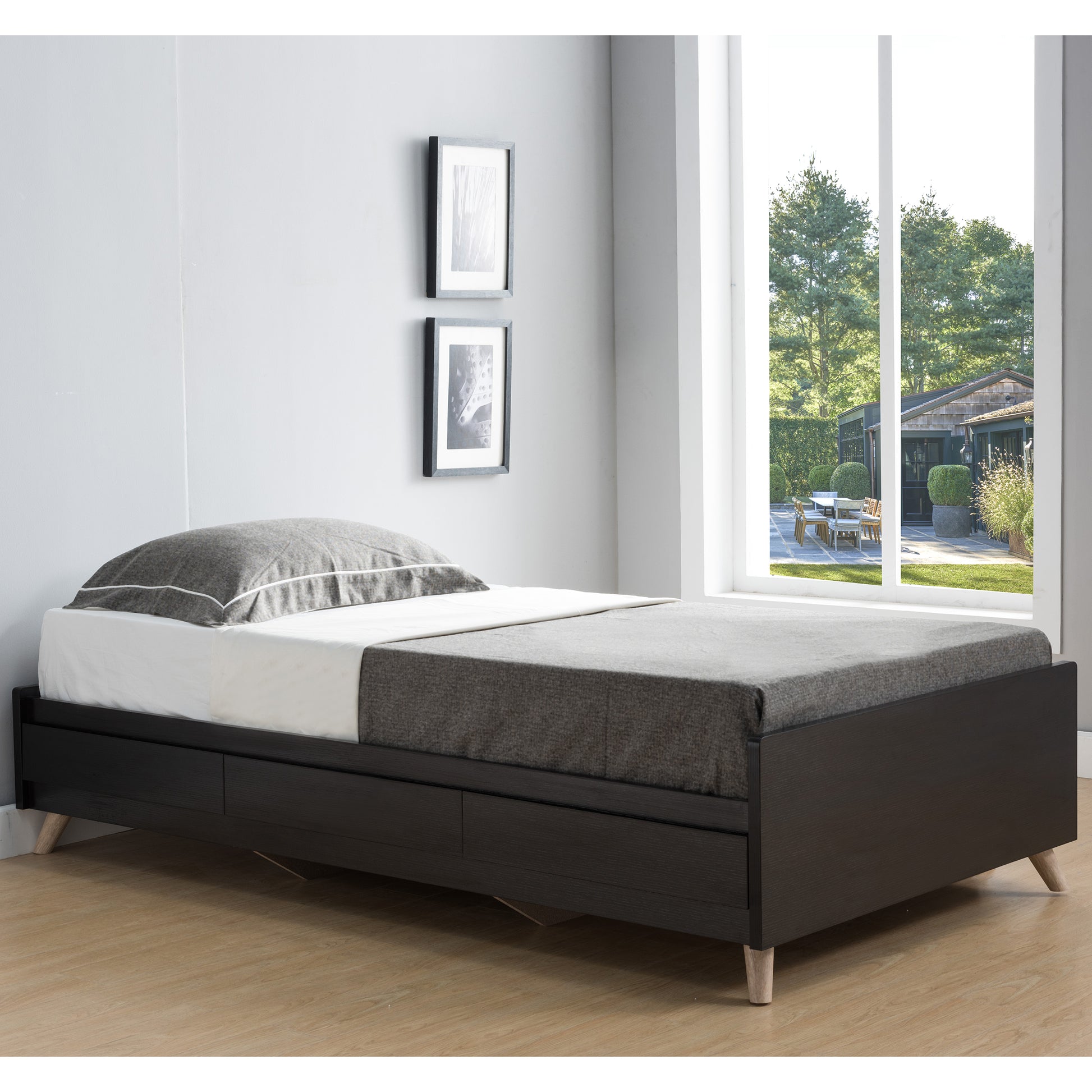 Right angled contemporary cappuccino three-drawer platform bed in a bedroom with accessories