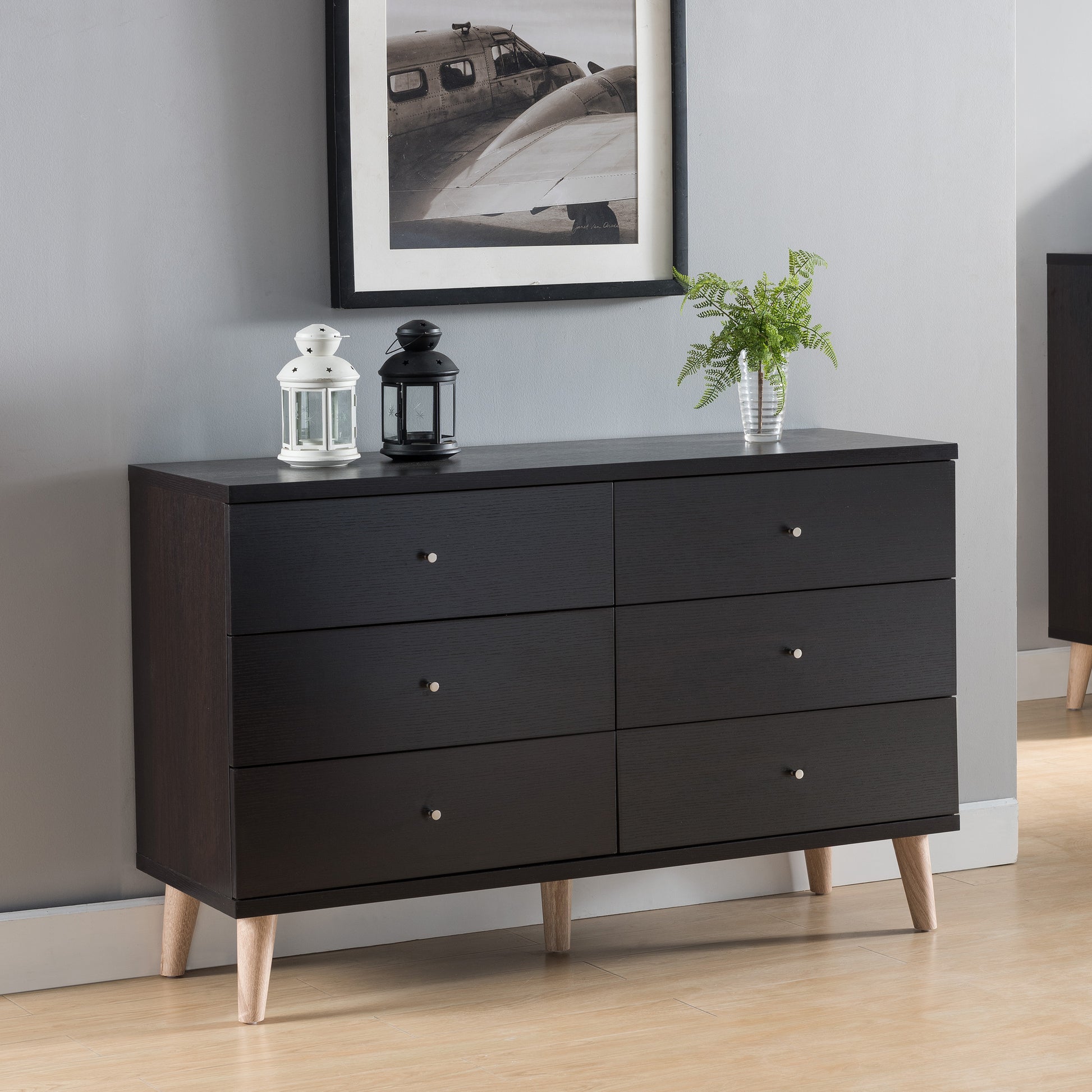 Right angled mid-century modern cappuccino six-drawer dresser in a bedroom with accessories