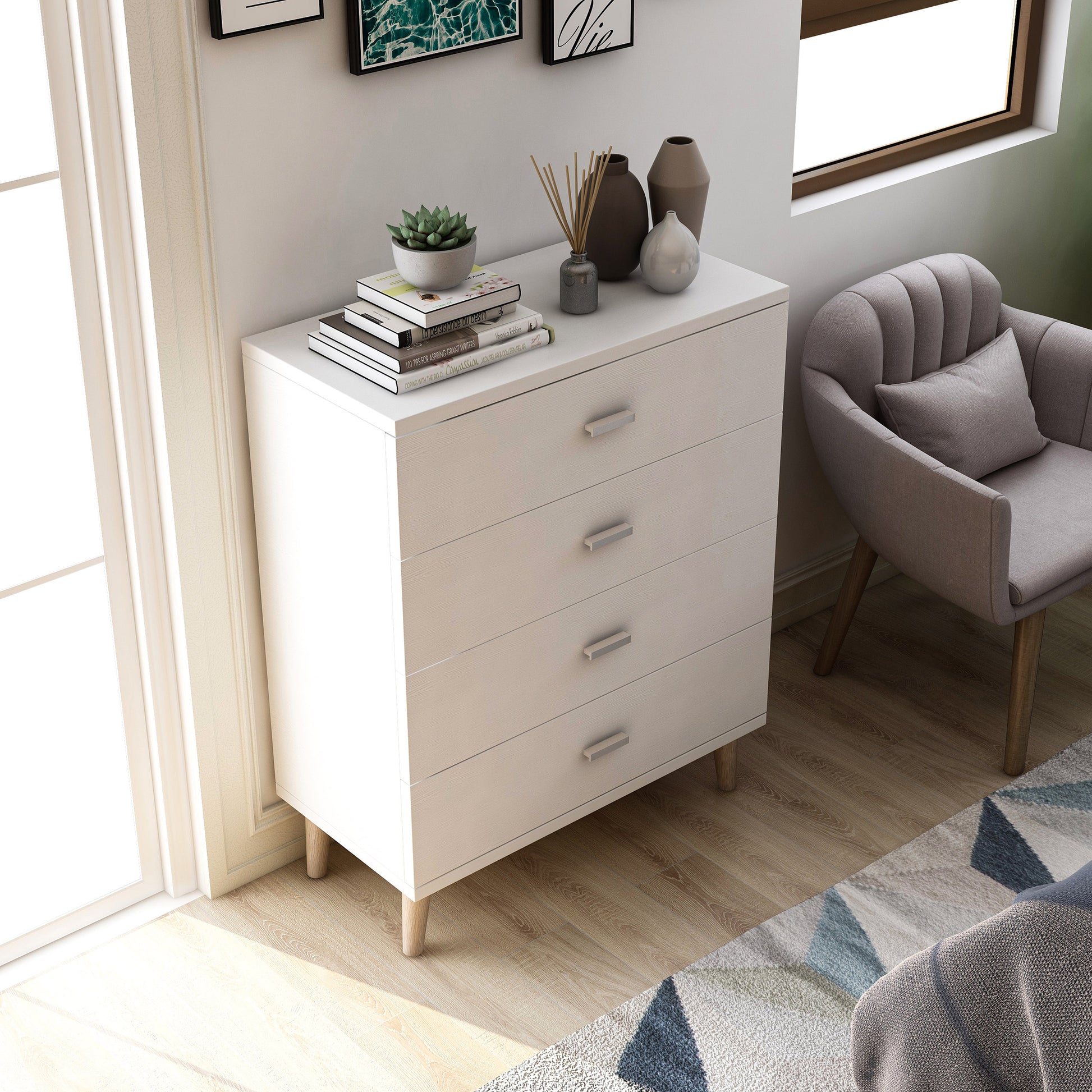 Right angled bird's eye view of a mid-century modern white four-drawer chest dresser in a bedroom with accessories