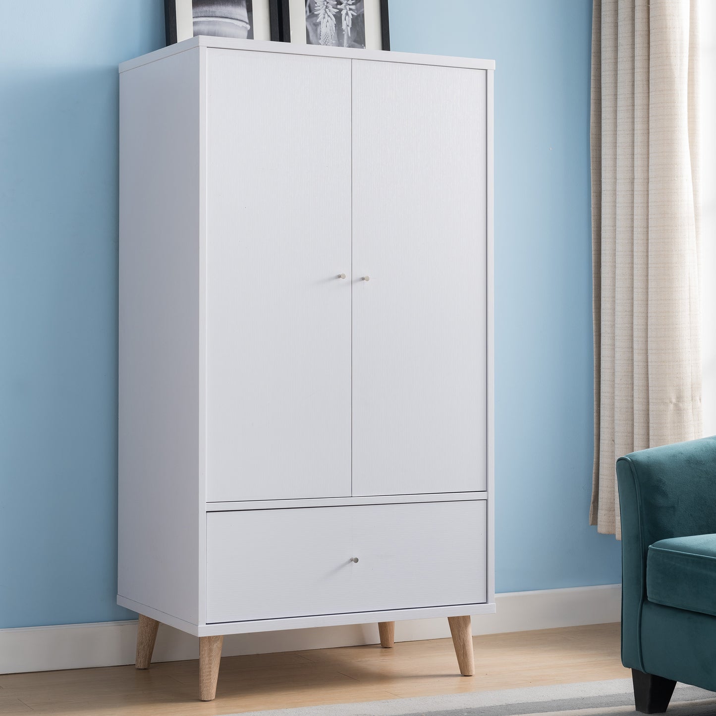 Right angled mid-century modern white two-door one-drawer wardrobe armoire in a bedroom with accessories