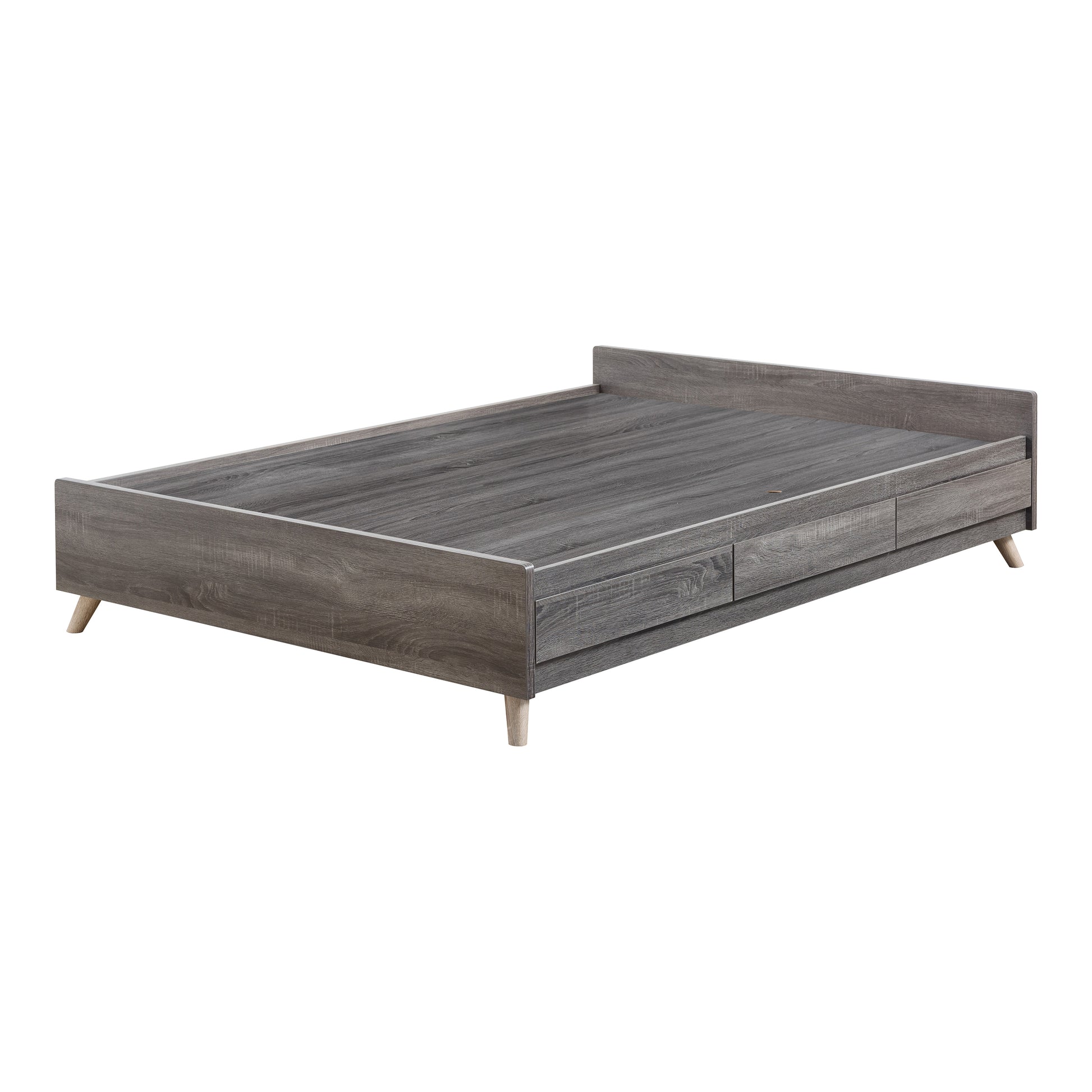 Left angled back/side view of a mid-century modern distressed gray platform storage bed with three drawers on a white background