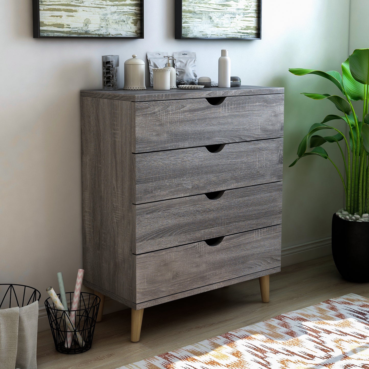 Right angled mid-century modern distressed gray four-drawer chest dresser in a bedroom with accessories