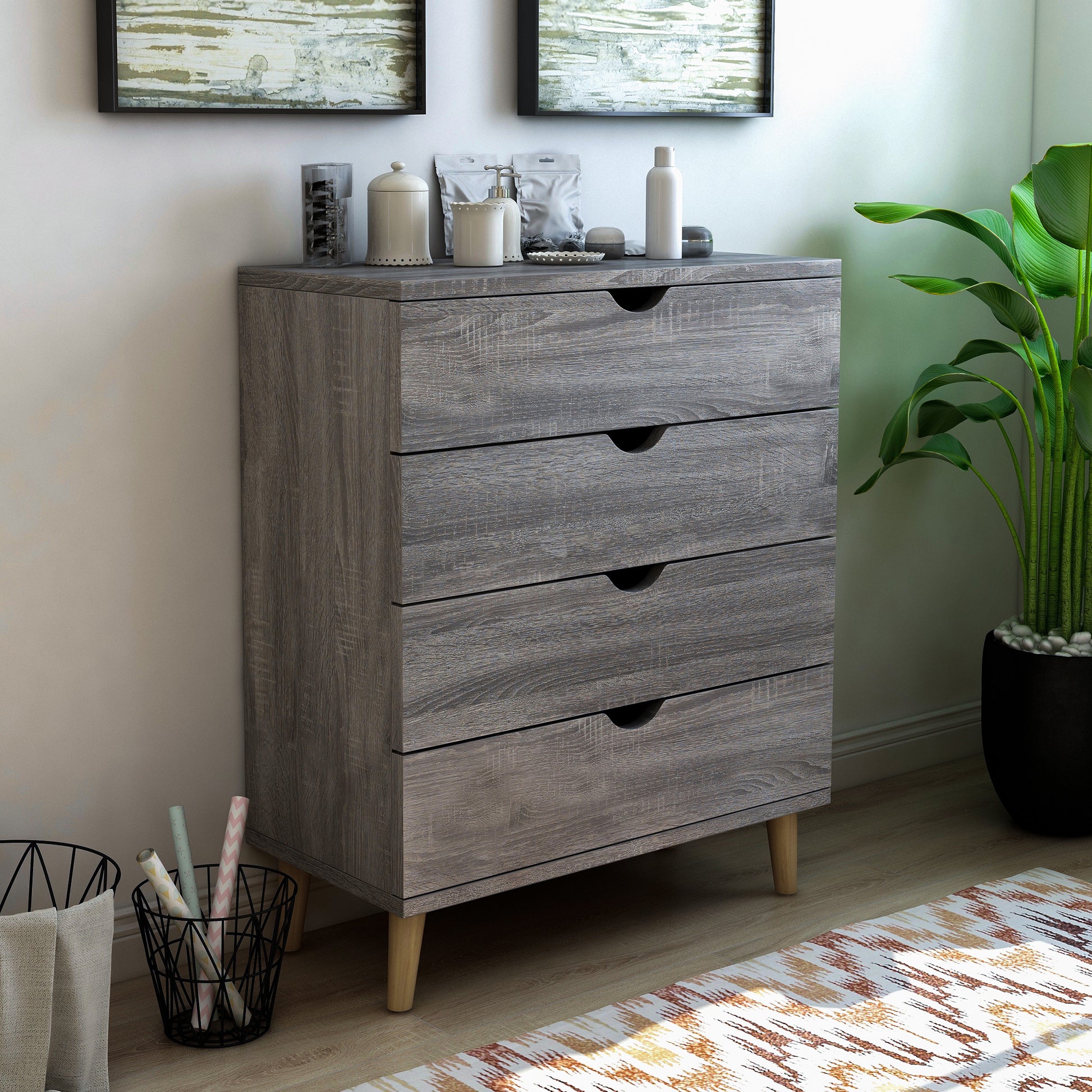 Right angled mid-century modern distressed gray four-drawer chest dresser in a bedroom with accessories