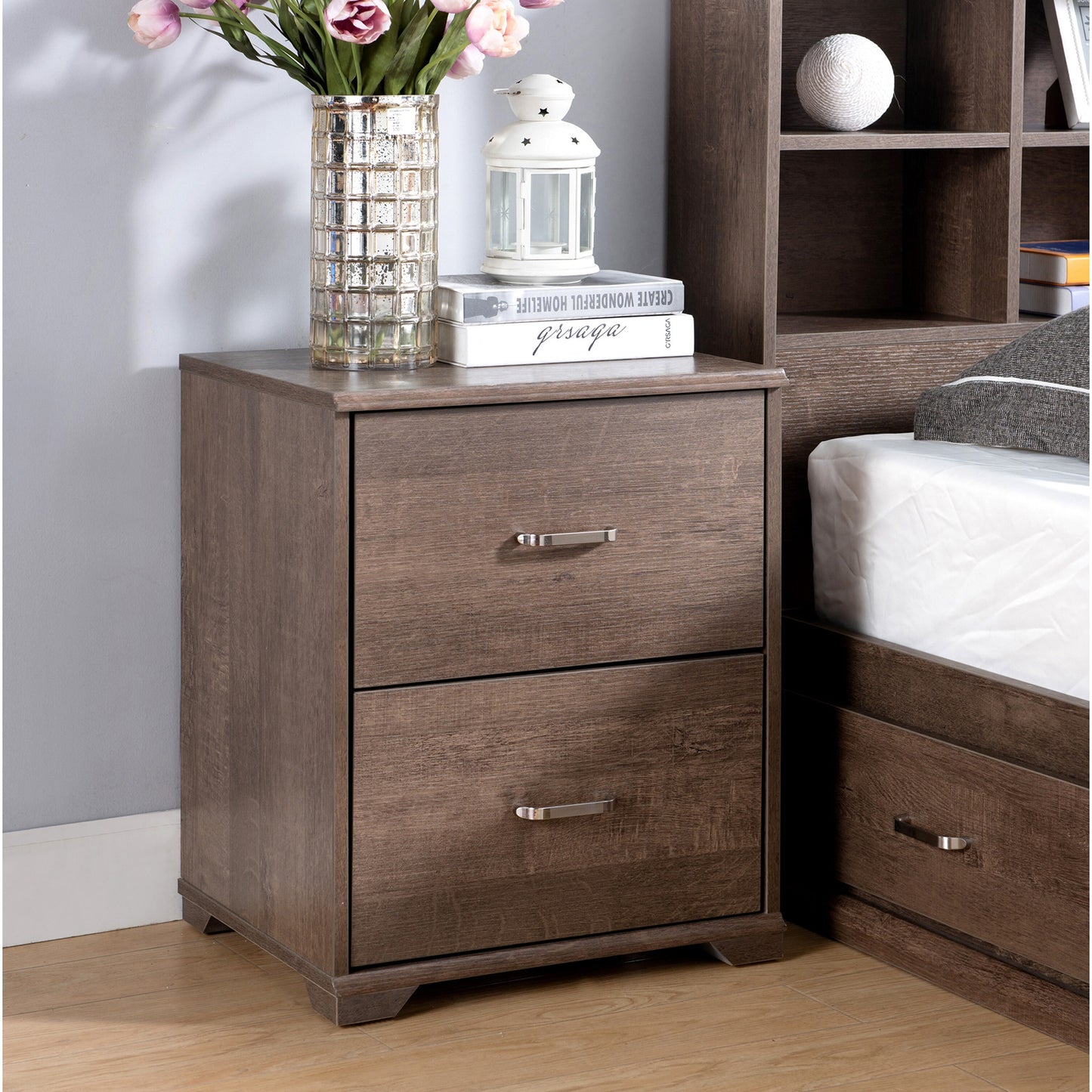 Right angled transitional walnut two-drawer nightstand in a bedroom with accessories