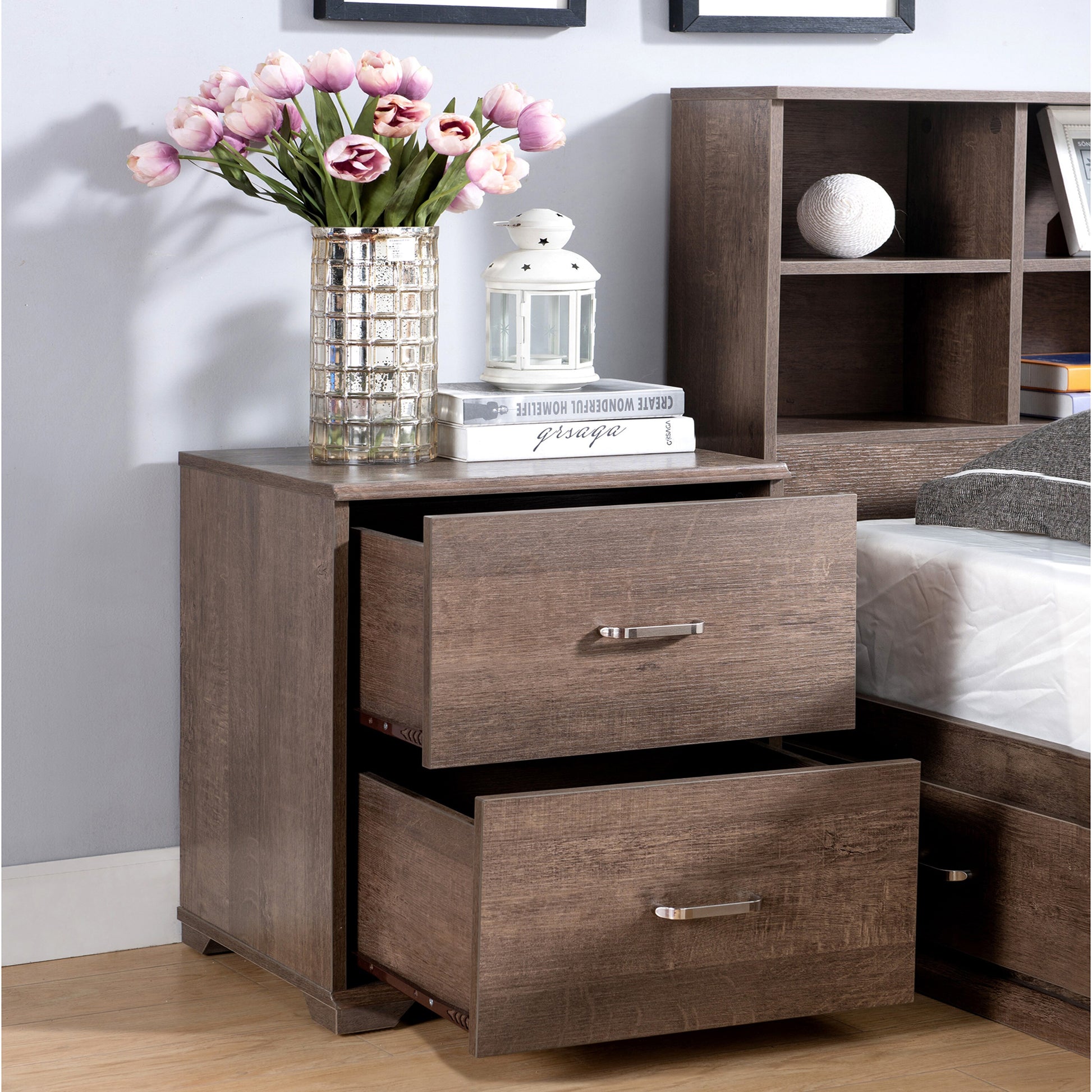 Right angled transitional walnut two-drawer nightstand with drawers open in a bedroom with accessories