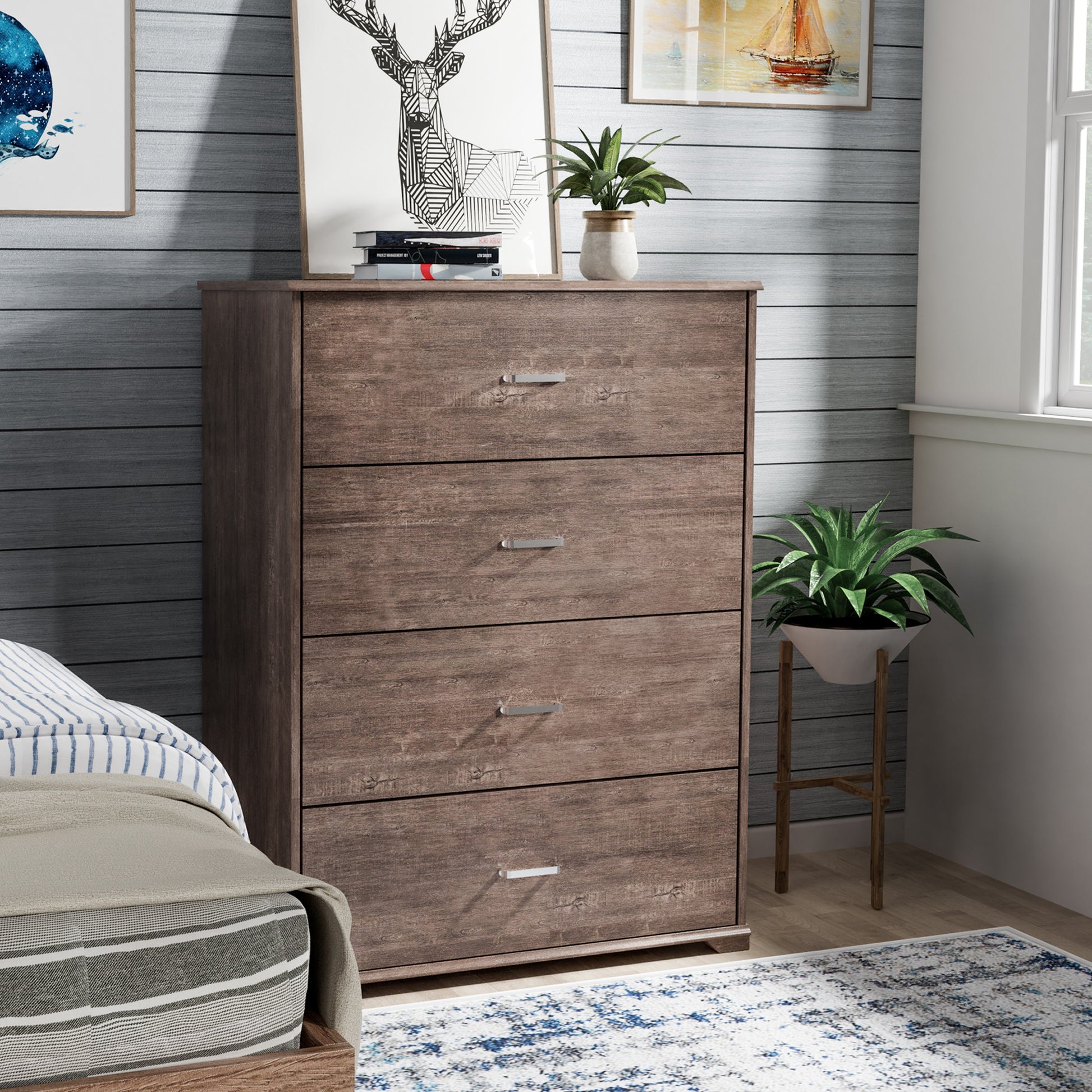 Right angled contemporary walnut four-drawer chest dresser in a bedroom with accessories