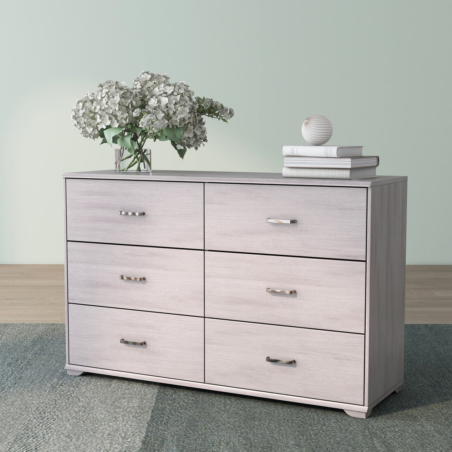 Left angled contemporary white oak six-drawer double dresser on a rug with accessories