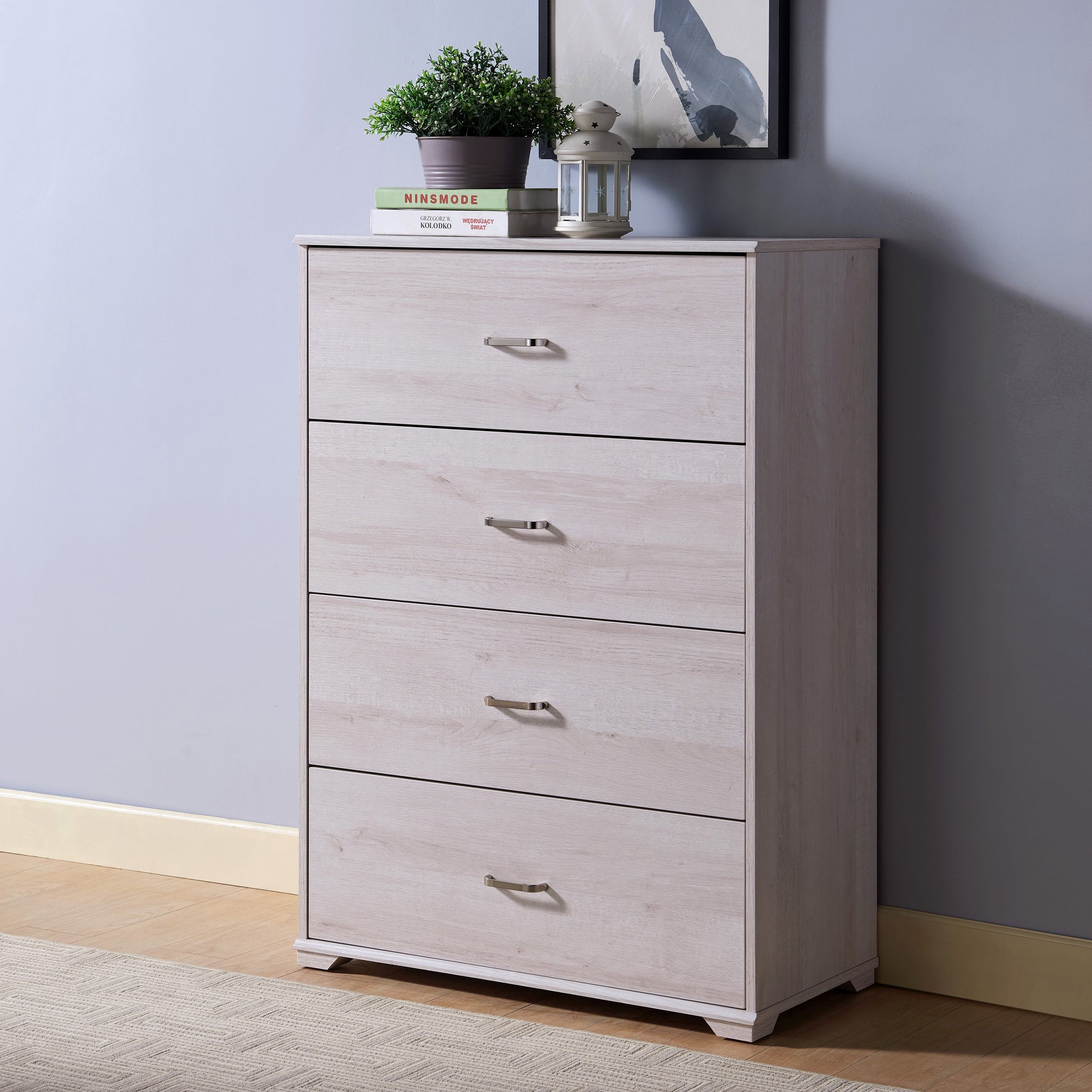 Left angled contemporary white oak four-drawer chest dresser with a rug and accessories