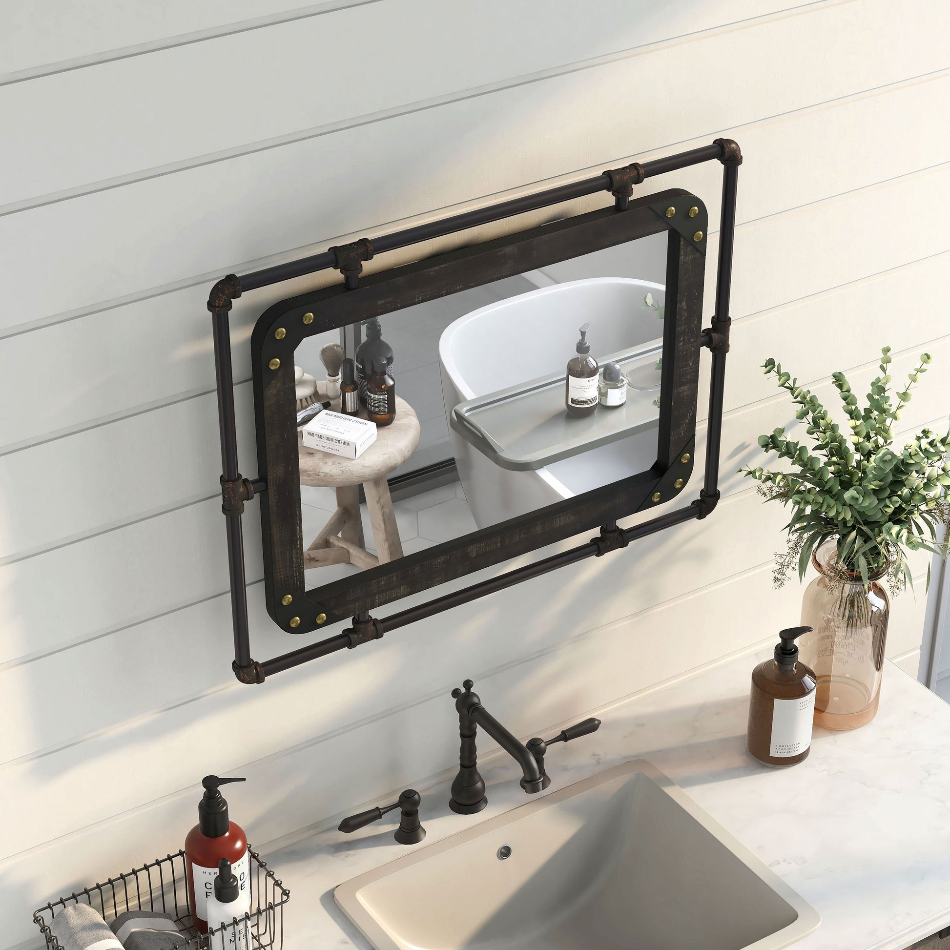 Right angled bird's eye view of an industrial reclaimed black oak and water pipe wall mirror over a vanity with accessories
