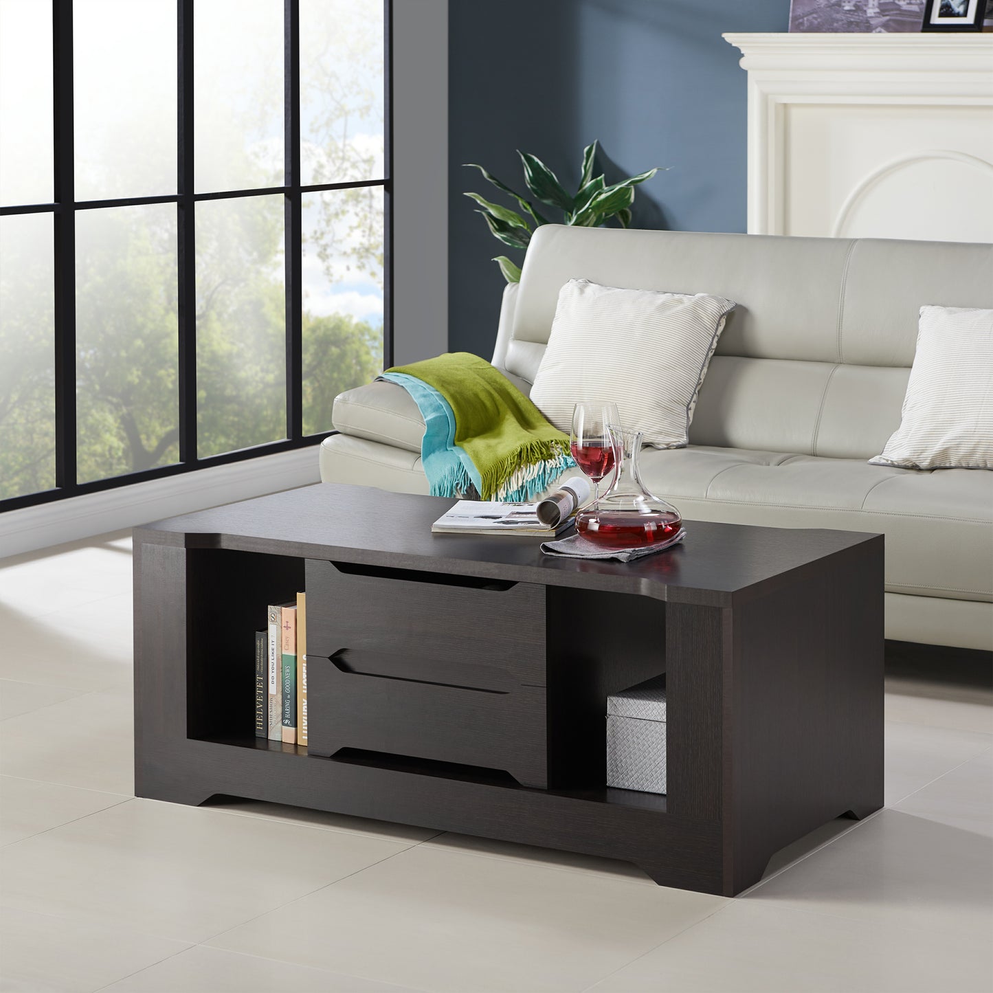 Left angled transitional espresso two-drawer storage coffee table in a living room with accessories