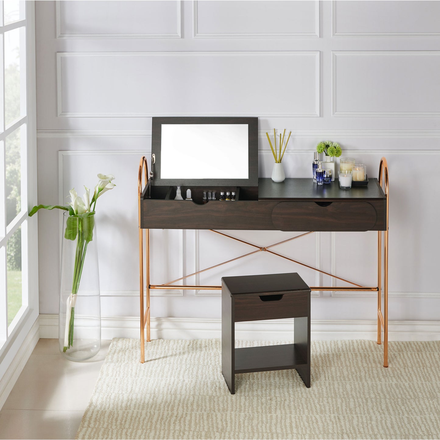 Front-facing modern glam walnut and gold lift-top vanity table with top lifted and a mirror in a living area with accessories