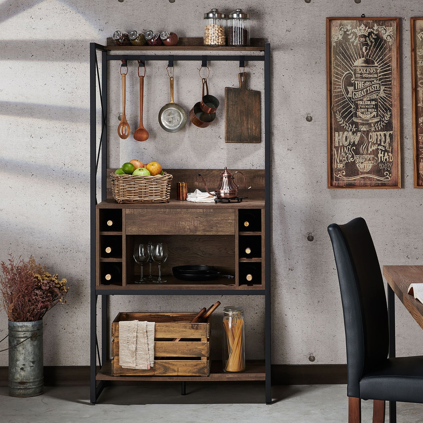 Front-facing industrial reclaimed oak and black multi-shelf baker's rack with hooks in a living area with accessories