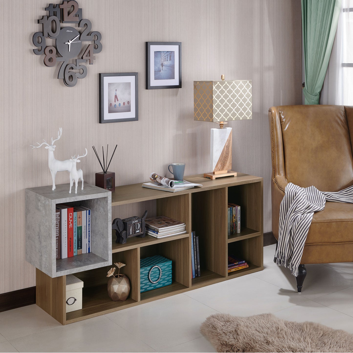 Right angled transitional honey walnut and concrete seven-shelf bookcase in a living room with accessories