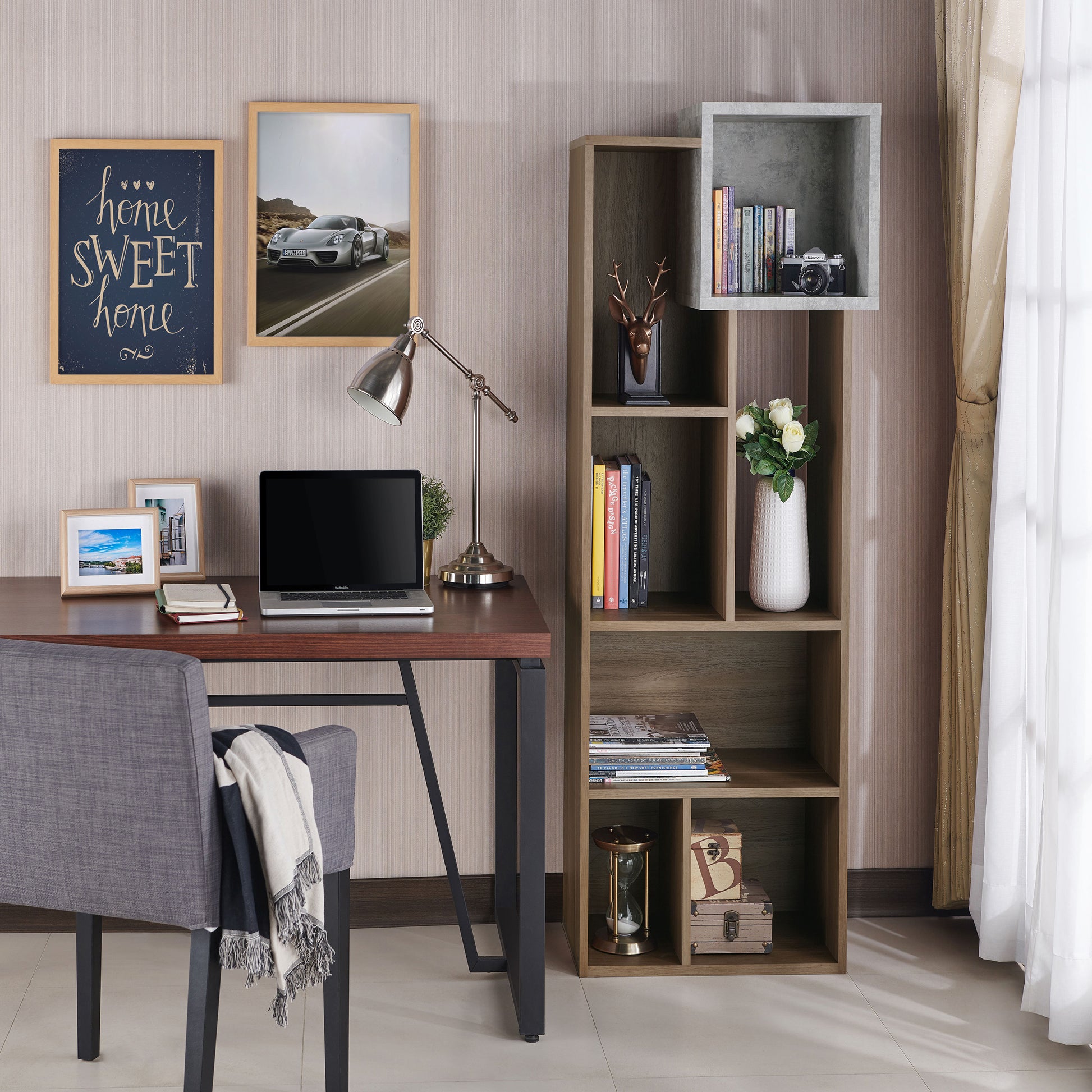 Right angled transitional honey walnut and concrete seven-shelf bookcase shown vertically in a home office with accessories