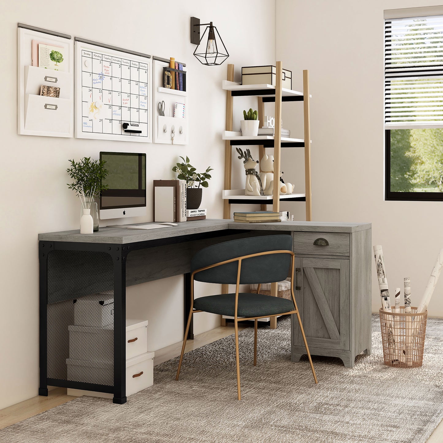 Right angled farmhouse vintage gray oak and black one-drawer L-shaped desk with a cabinet in a home office with accessories