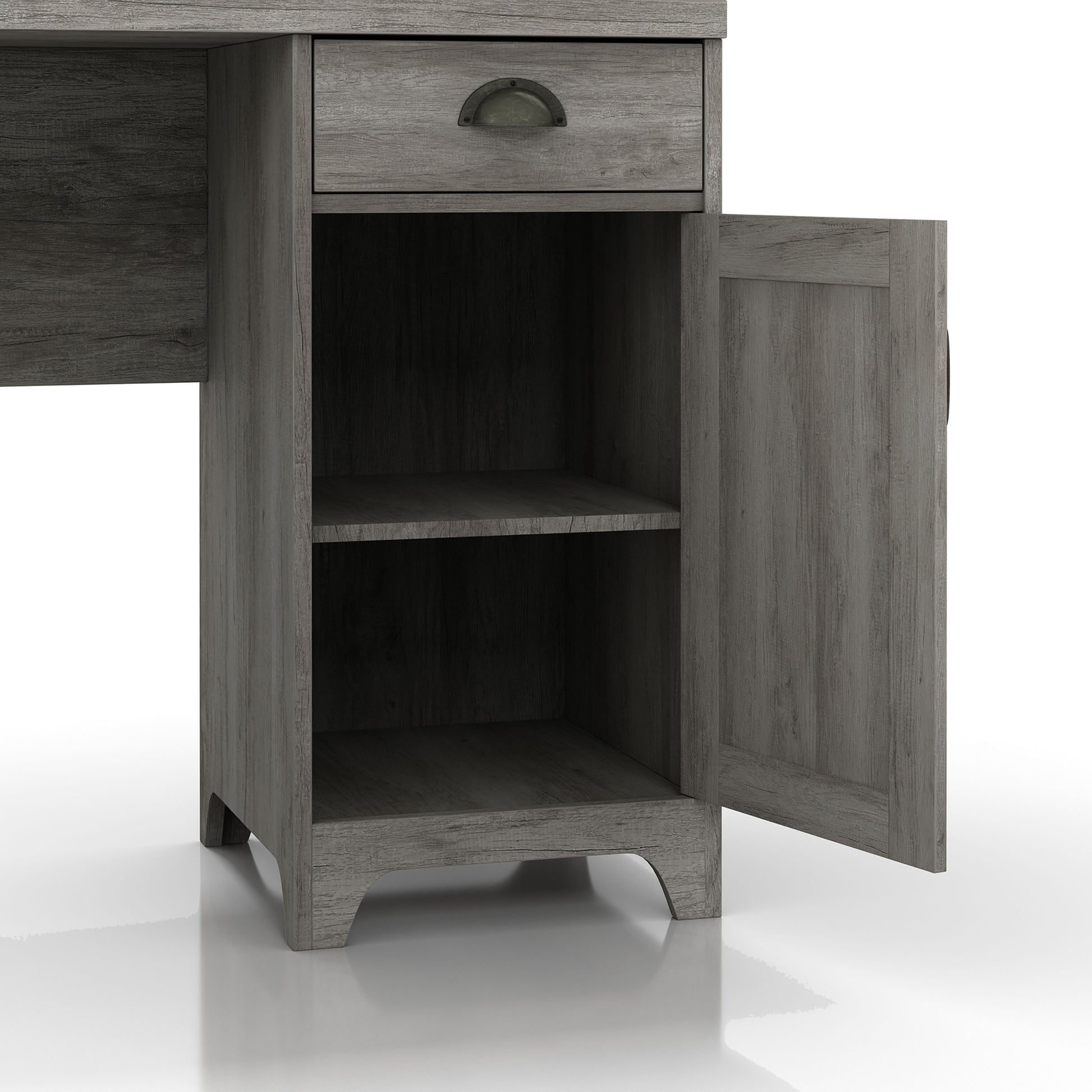 Right angled close-up view of a farmhouse vintage gray oak and black one-drawer L-shaped desk with a cabinet door open on a white background