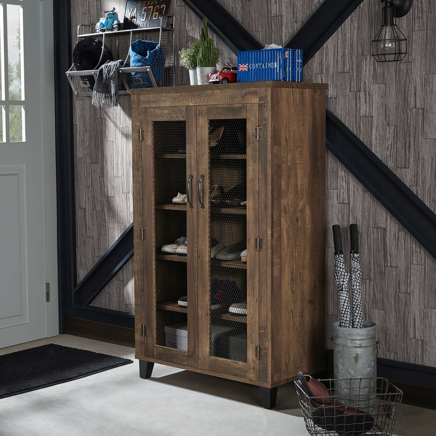 Left angled rustic reclaimed oak five-shelf shoe cabinet with mesh doors in an entryway with accessories