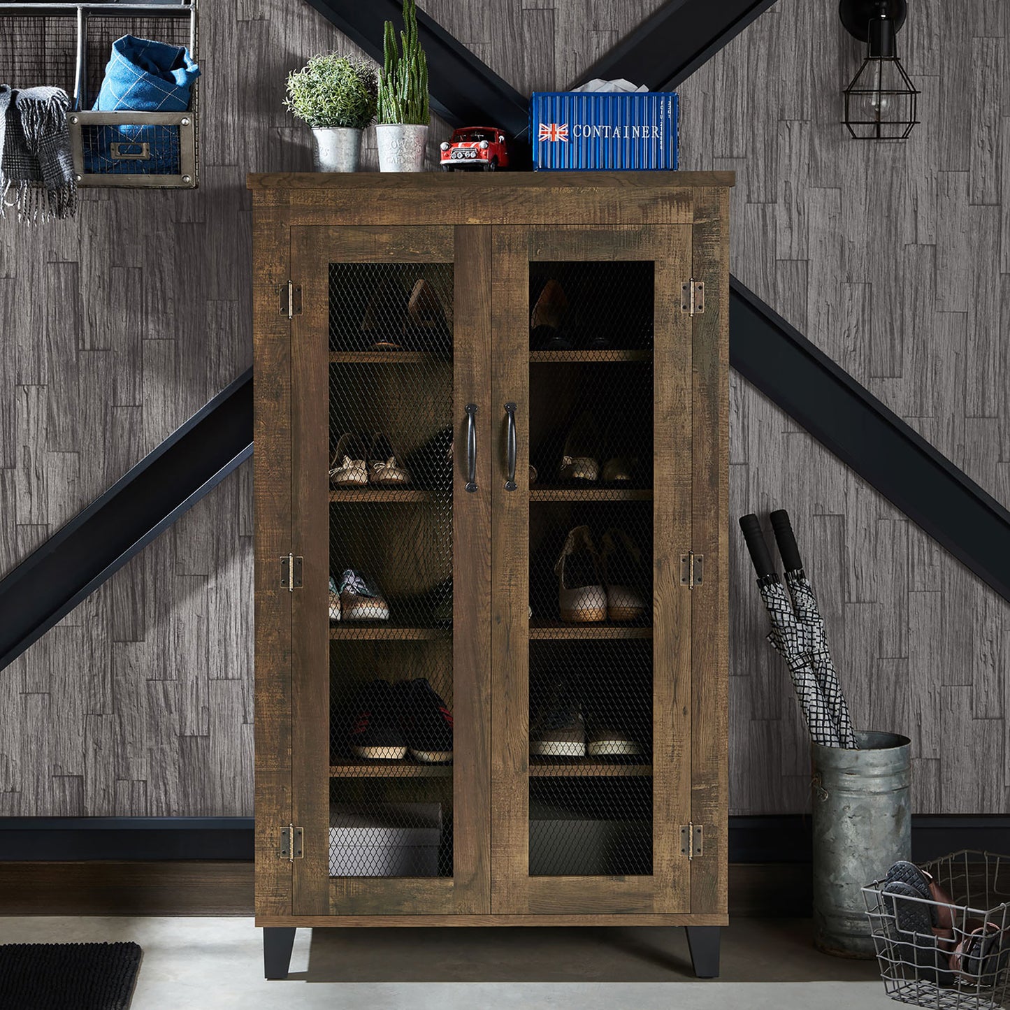 Front-facing rustic reclaimed oak five-shelf shoe cabinet with mesh doors in an entryway with accessories