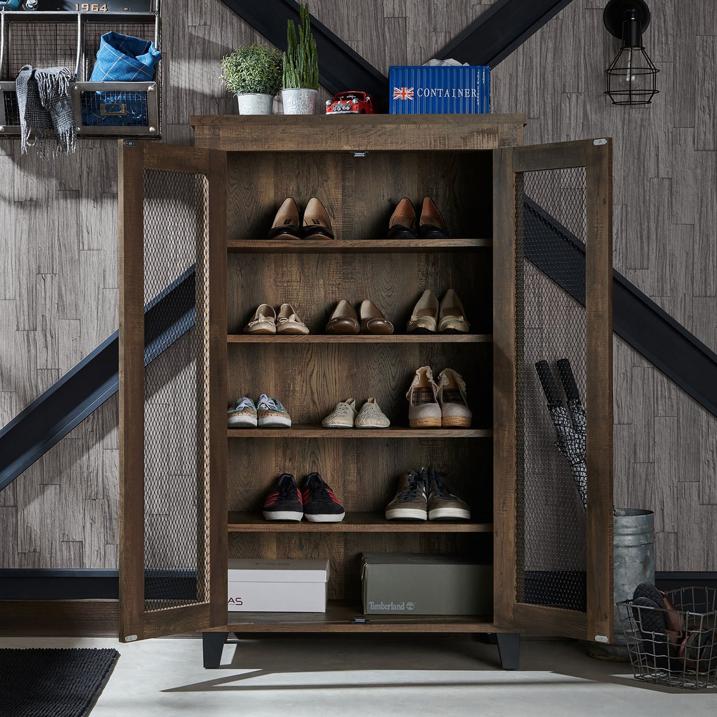 Front-facing rustic reclaimed oak five-shelf shoe cabinet with mesh doors open in an entryway with accessories