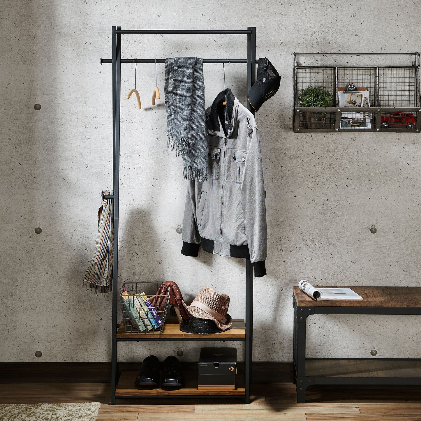 Front-facing industrial warm oak and black two-shelf six-hook coat rack in an entry with accessories