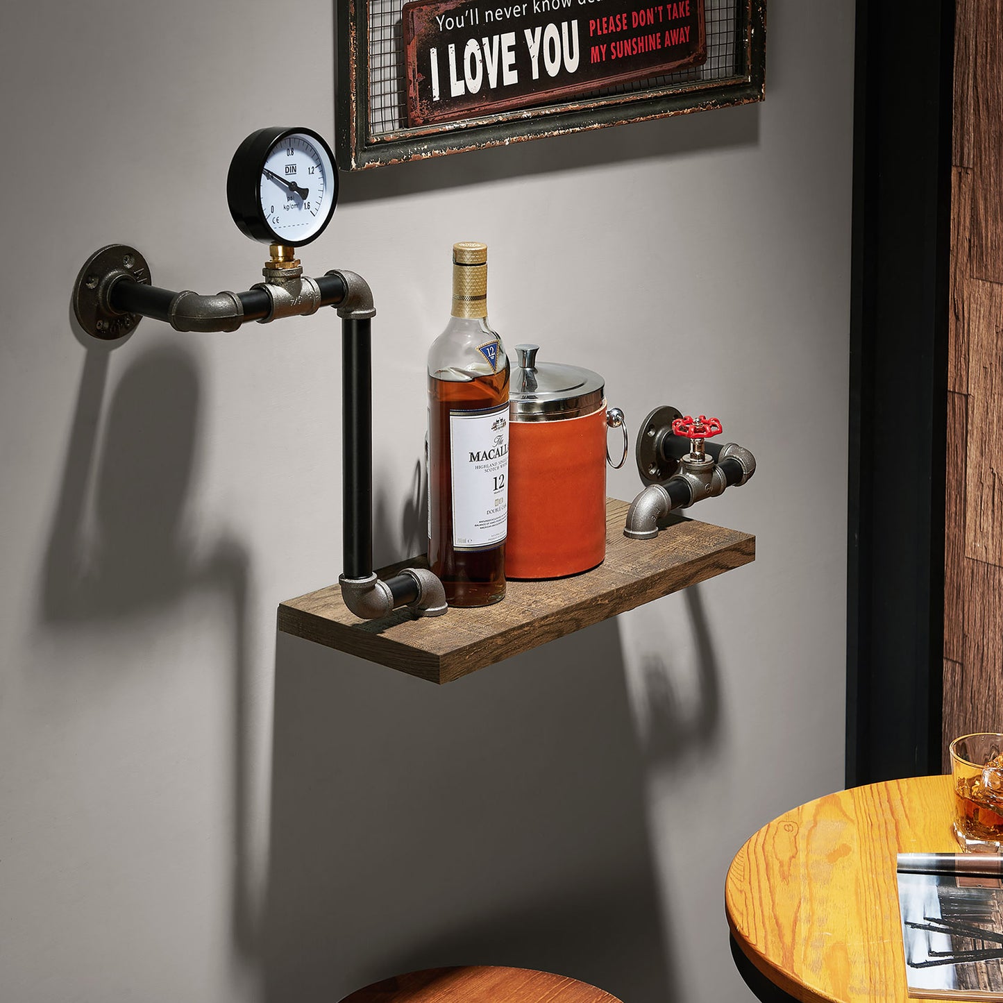 Right angled industrial reclaimed oak water pipe wall shelf in a dining room with accessories