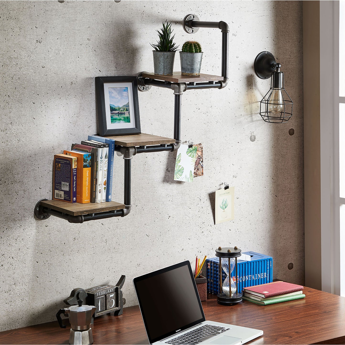 Right angled industrial reclaimed oak three-tier water pipe wall shelf in a home office with accessories