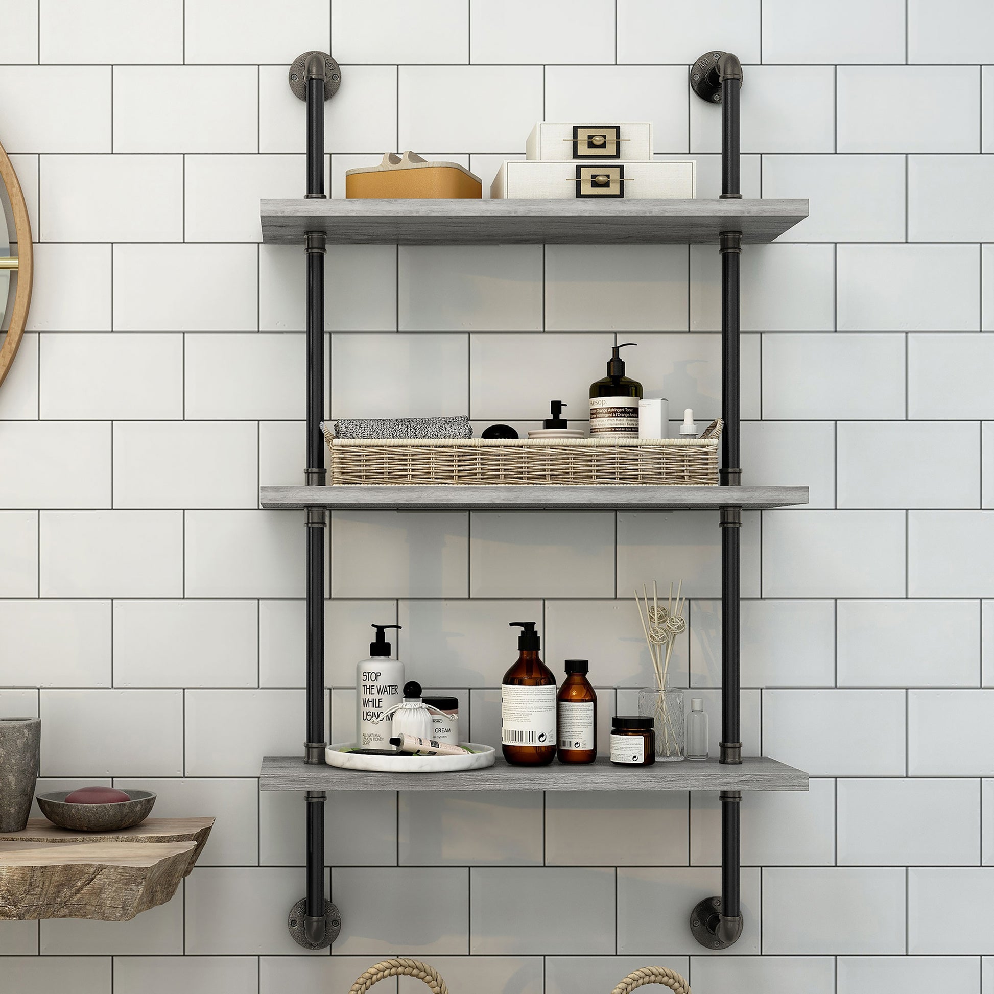 Front-facing industrial vintage gray oak three-tier water pipe wall shelf in a bathroom with accessories