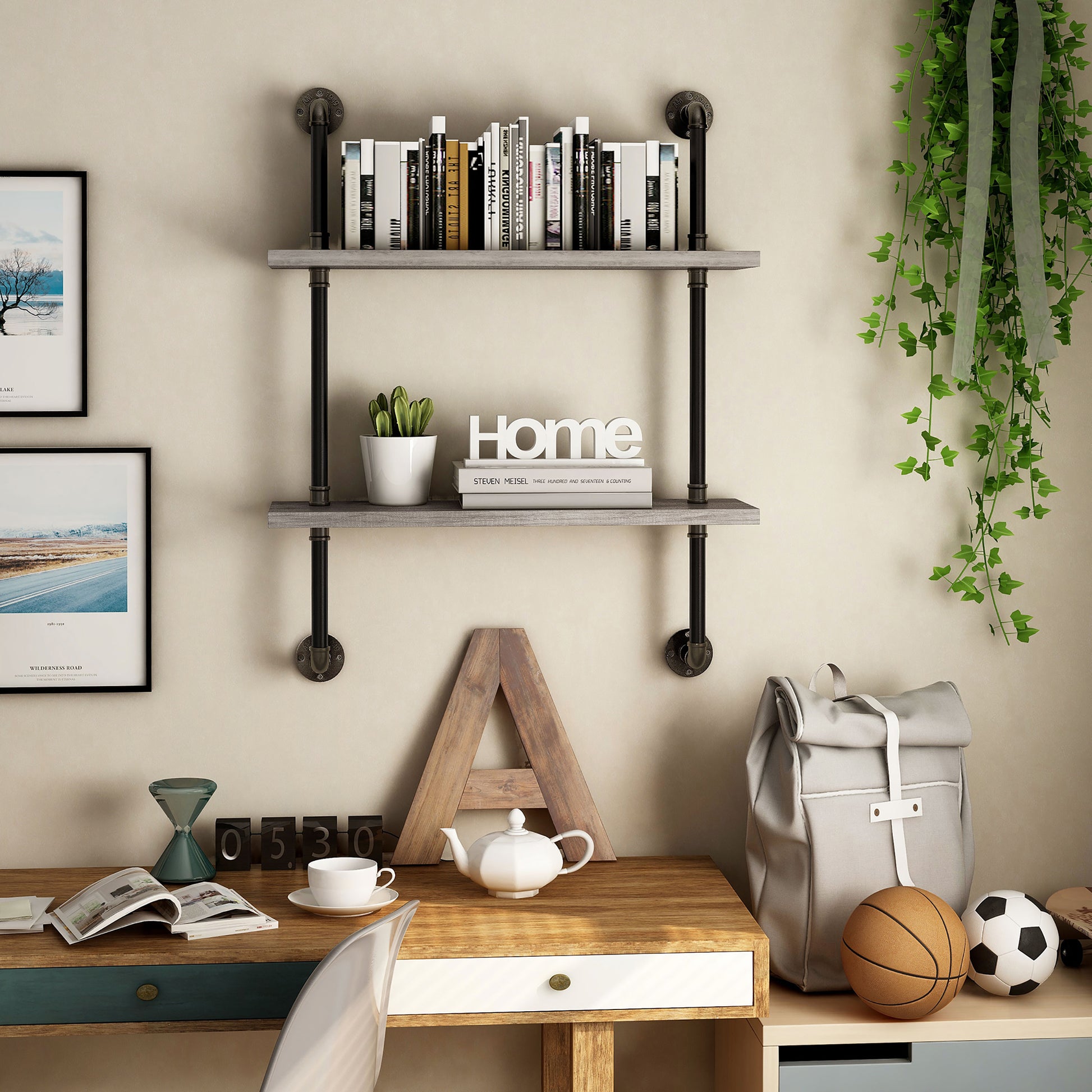 Front-facing industrial vintage gray oak two-tier water pipe wall shelf in a home office with accessories