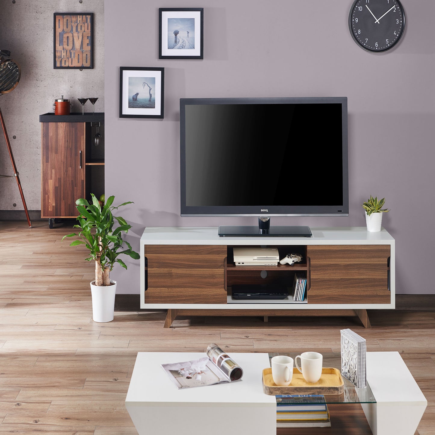 Front-facing mid-century modern white and walnut two-door eight-shelf TV stand in a living room with accessories