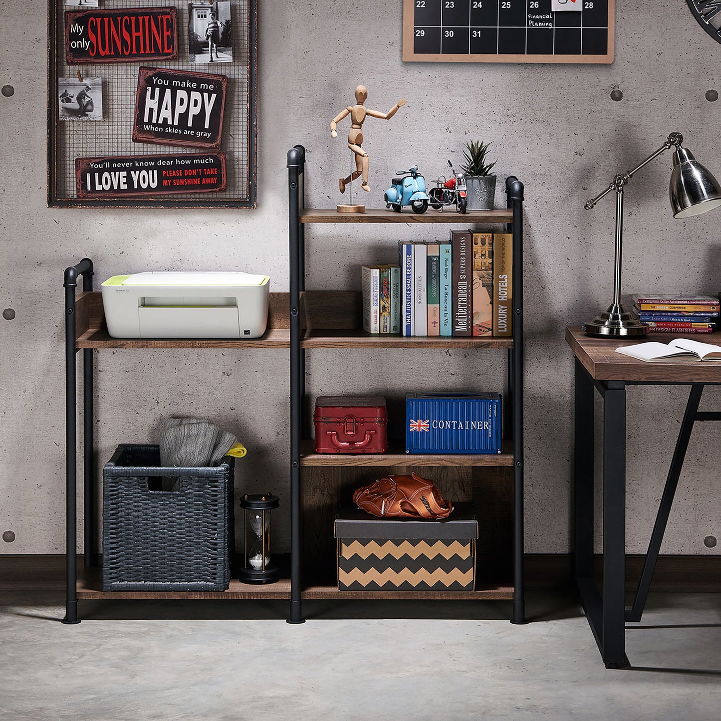 Front-facing industrial reclaimed oak and black water pipe six-shelf open bookcase in a home office with accessories