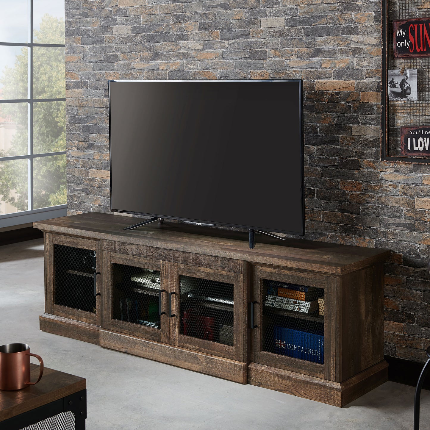 Left angled rustic reclaimed oak six-shelf TV stand with mesh doors in a living room with accessories