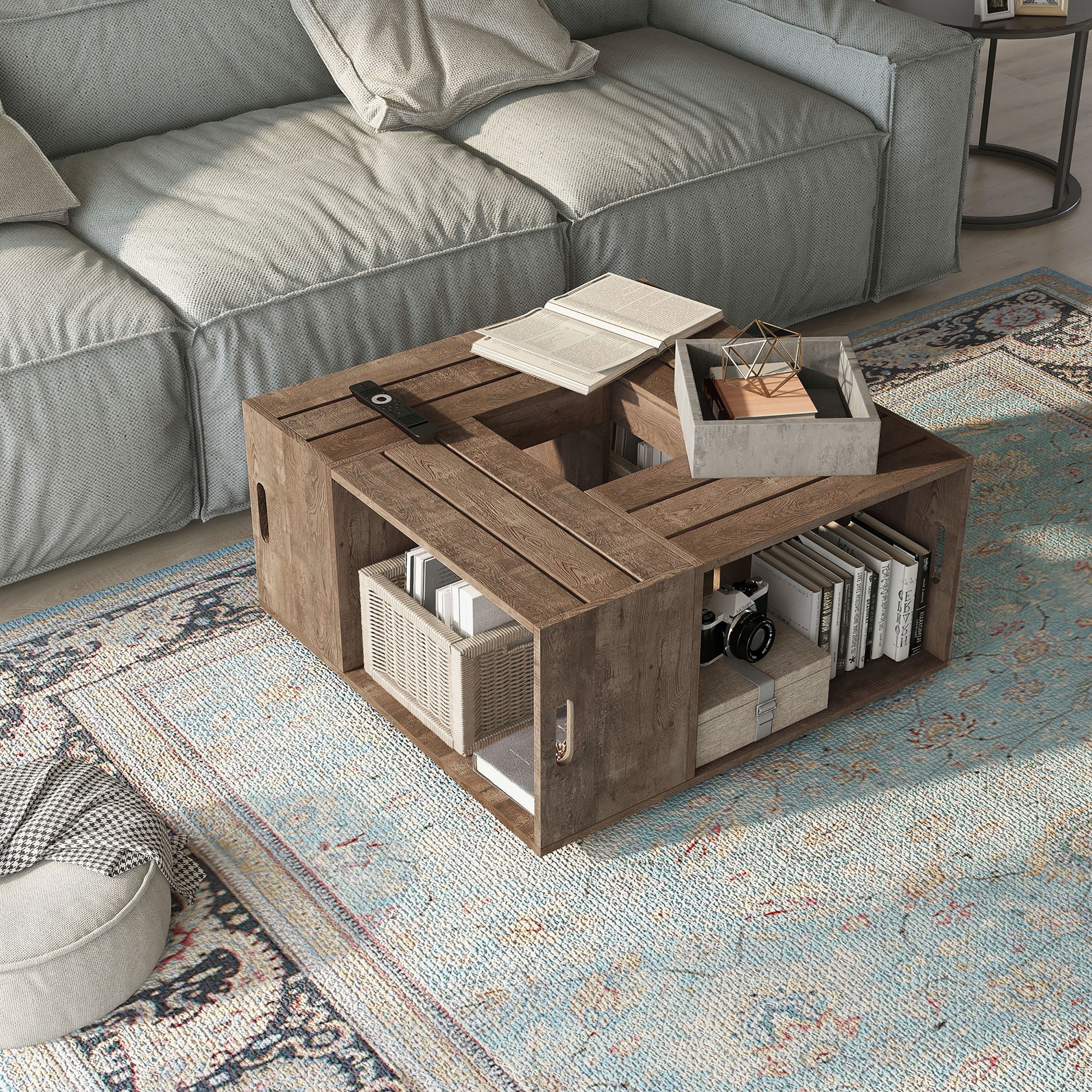 Right angled bird's eye view of a rustic reclaimed oak crate-style mobile storage coffee table in a living room with accessories