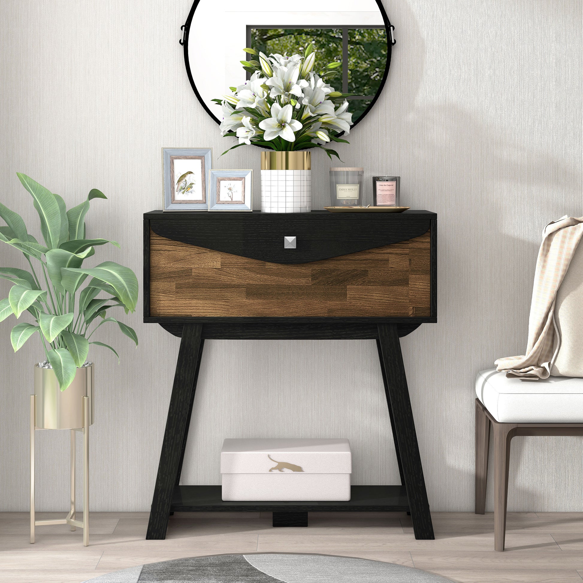 Left angled modern black and wood one-drawer console table with a shelf in a living room with accessories