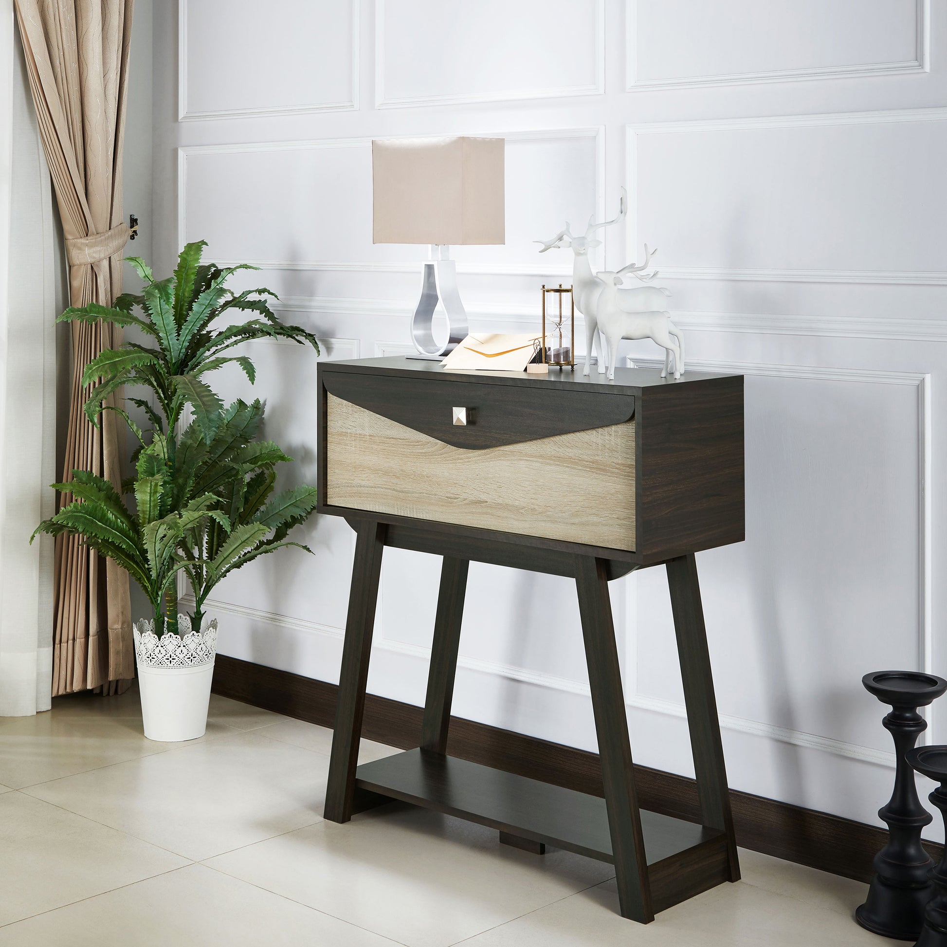 Left angled modern wenge and light wood one-drawer console table with a shelf in a living room with accessories