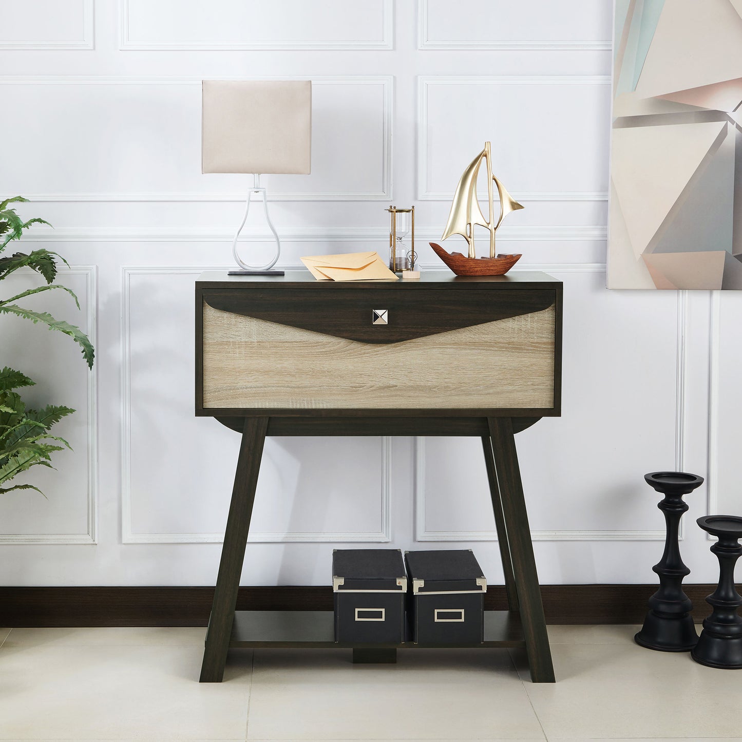 Front-facing modern wenge and light wood one-drawer console table with a shelf in a living room with accessories