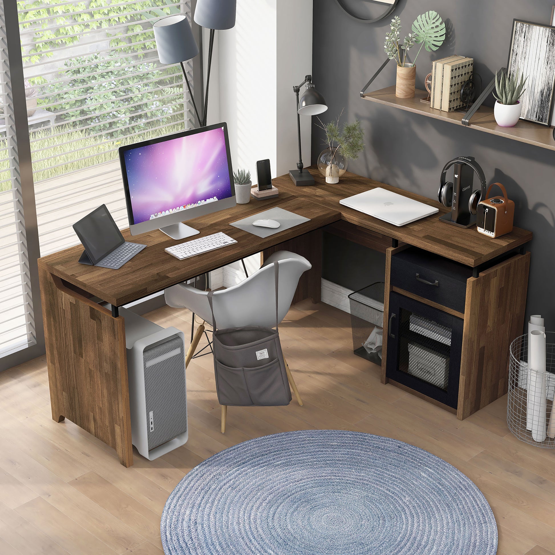 Right angled bird's eye view of a rustic light hickory and black mixed material multi-storage L-shaped desk in a home office with accessories