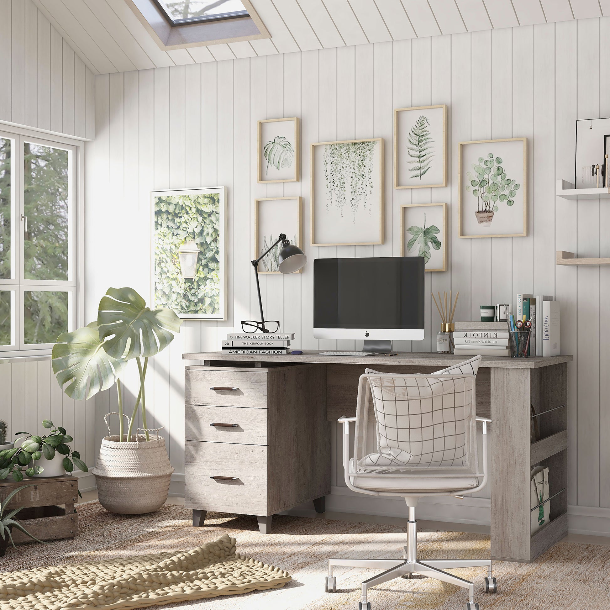 Left angled transitional coastal white three-drawer office desk with magazine racks in a home office with accessories