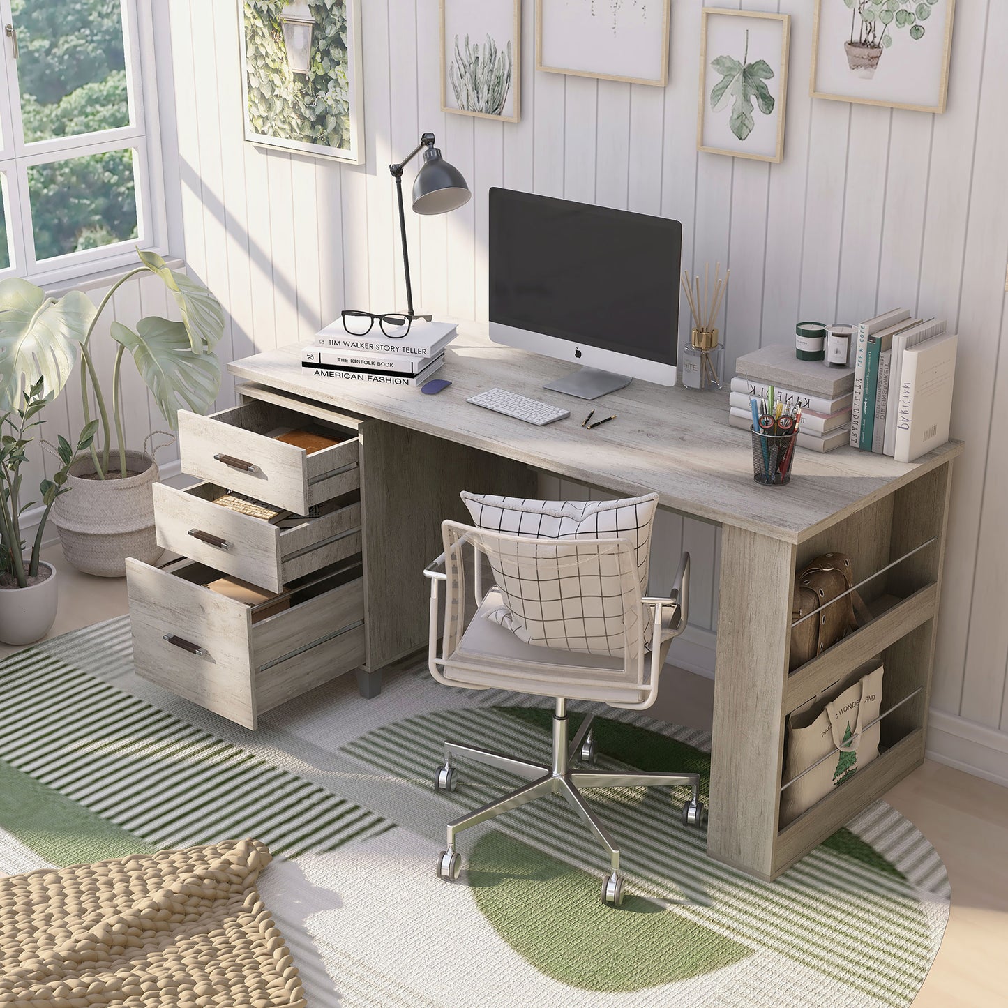 Left angled bird's eye view of a transitional coastal white three-drawer office desk with magazine racks and drawers open in a home office with accessories