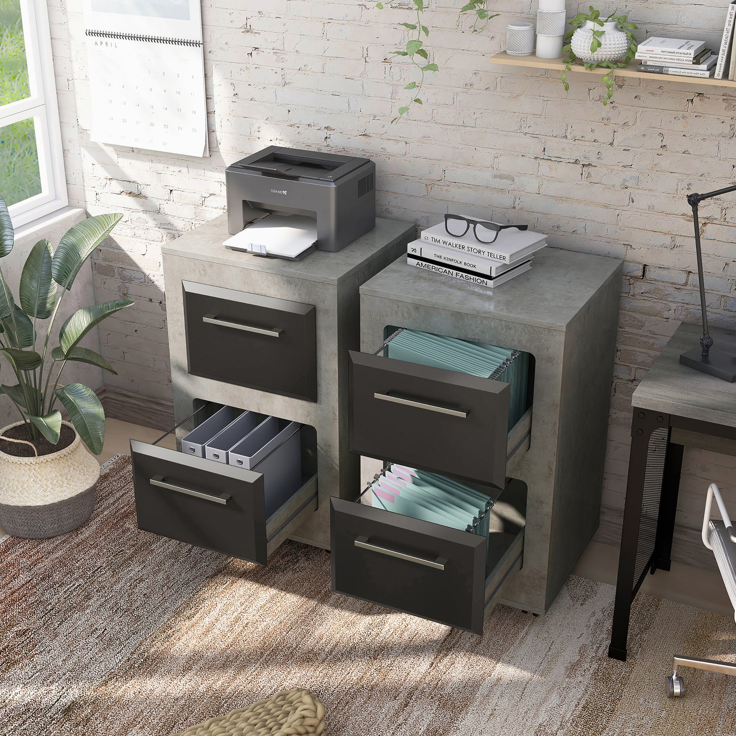 Left angled contemporary cement two-tone two-drawer mobile file cabinet with drawers open and a second cabinet also shown in a home office with accessories
