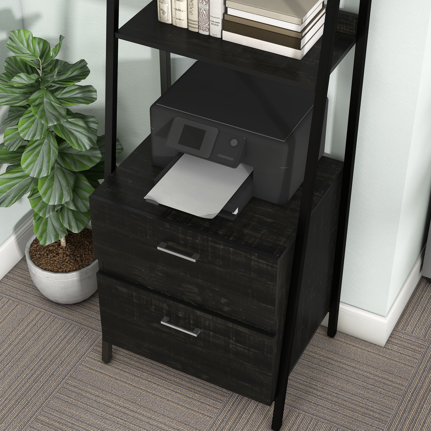 Left angled close-up view of a contemporary reclaimed black oak and black angular two-shelf bookcase with two-drawer file cabinet in a home office with accessories