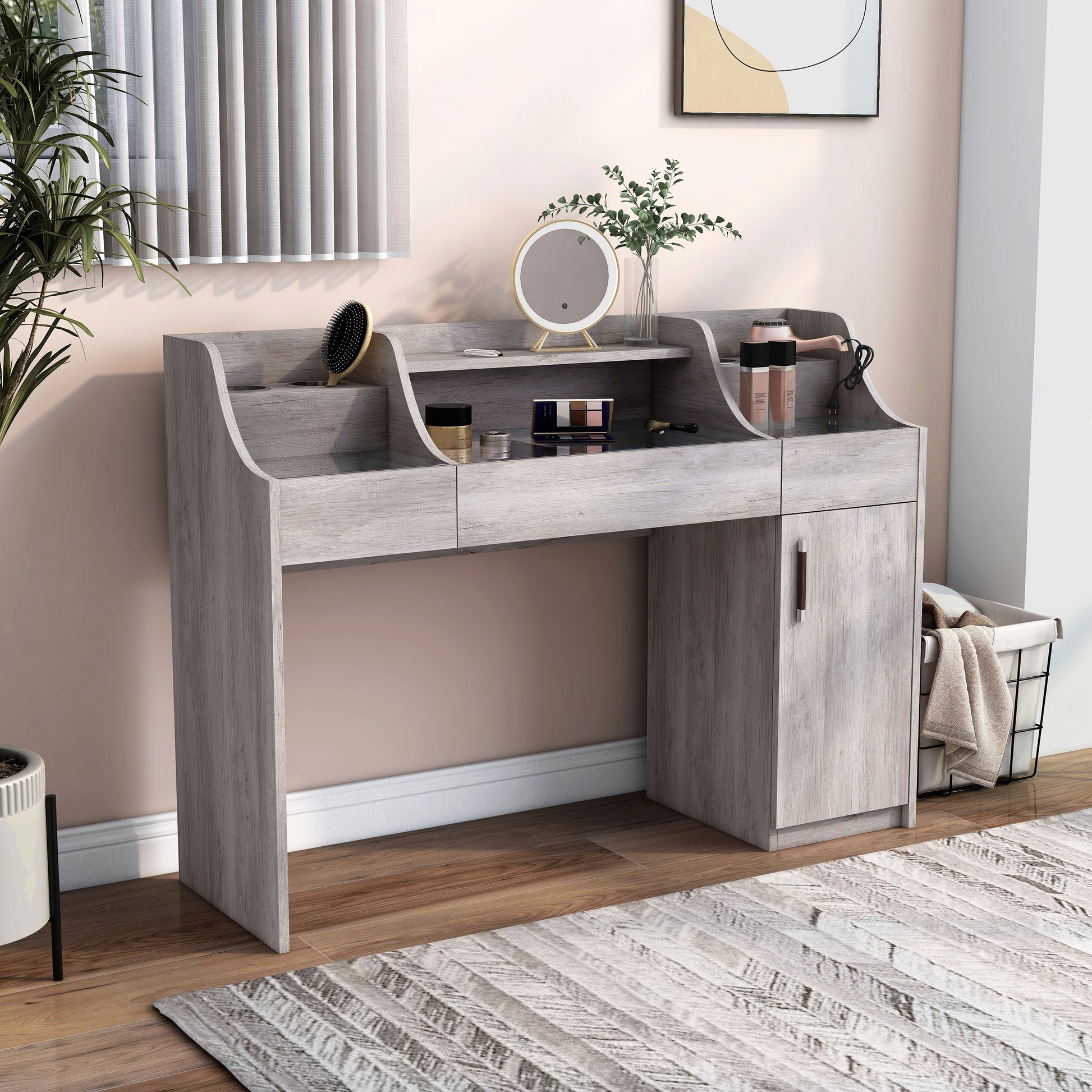 Right angled transitional coastal white three-drawer vanity table with grommets and glass drawer tops in a bedroom with accessories