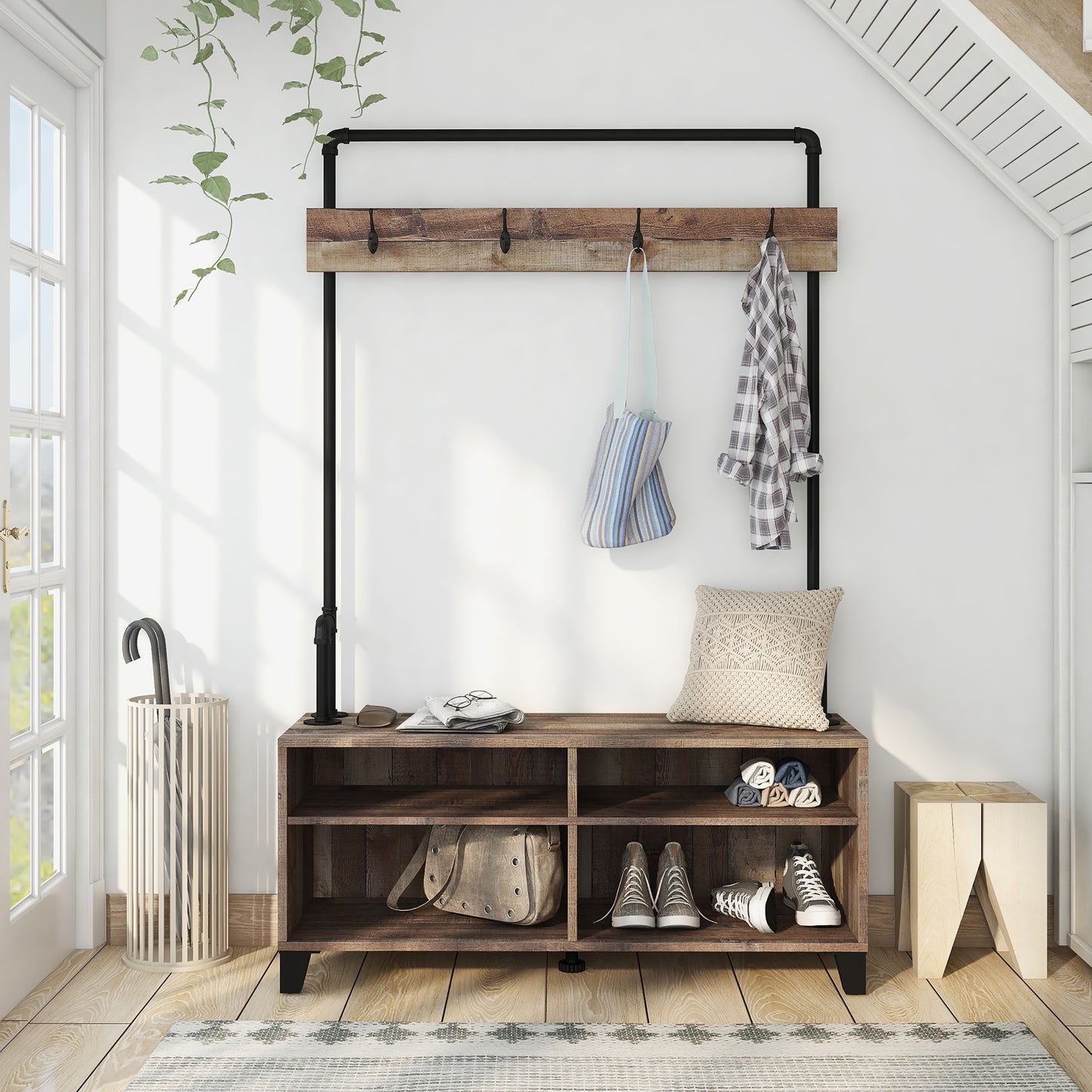 Front-facing industrial reclaimed barnwood water pipe four-shelf entryway coat rack bench in an entry with accessories